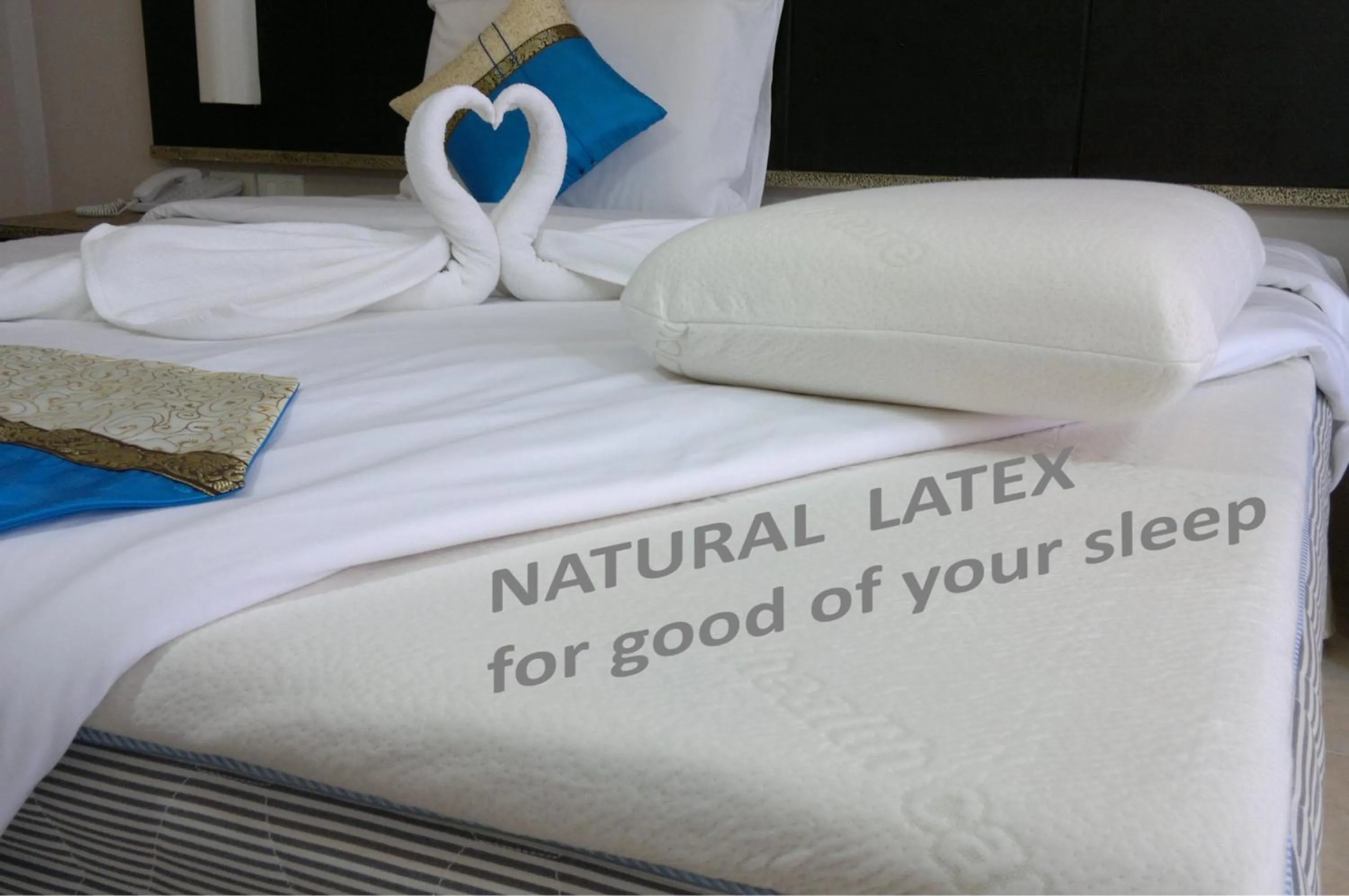 Bed in U Sabai Living Hotel