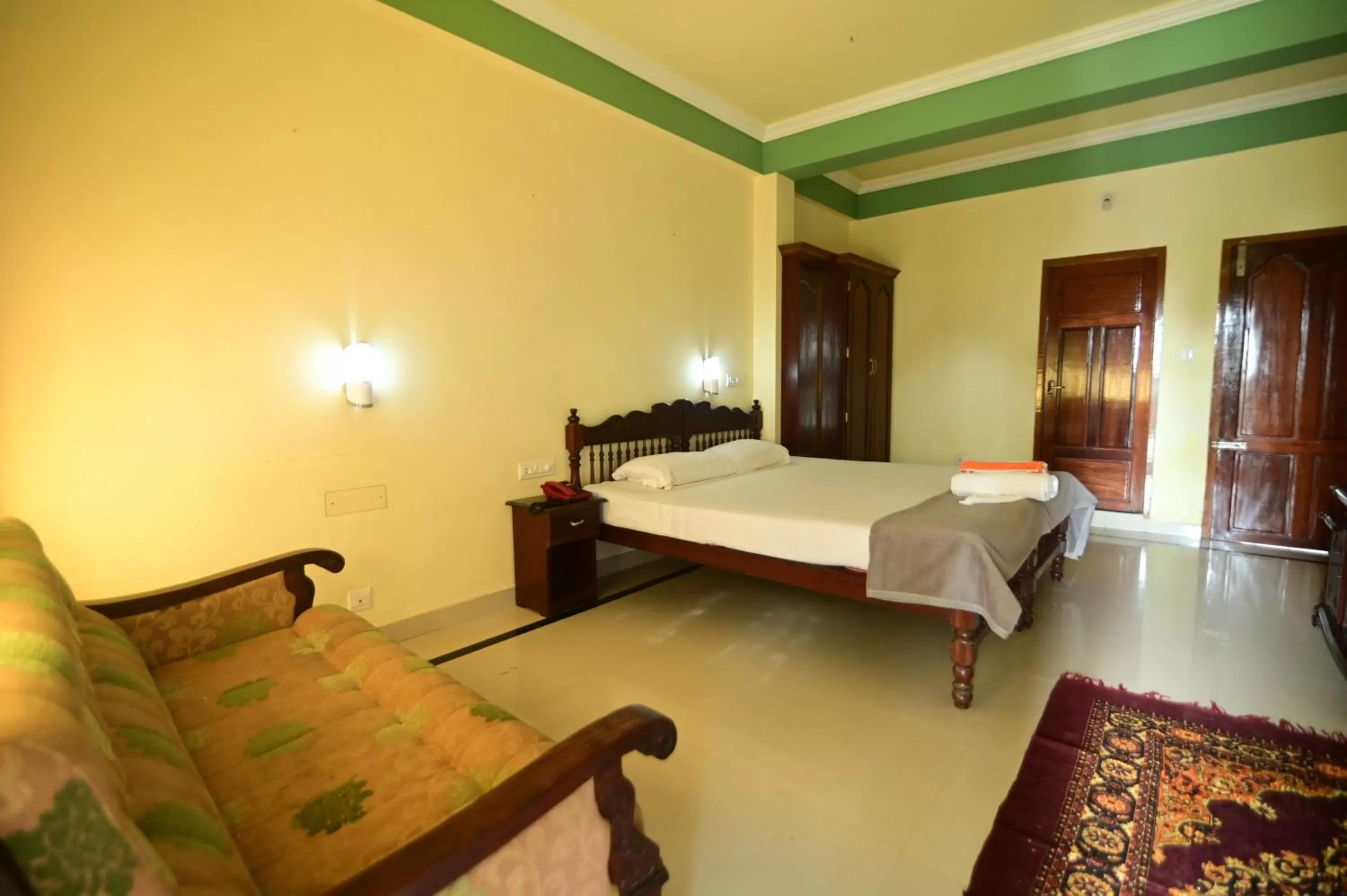 Bed in Sree Mookambika Beach Resort