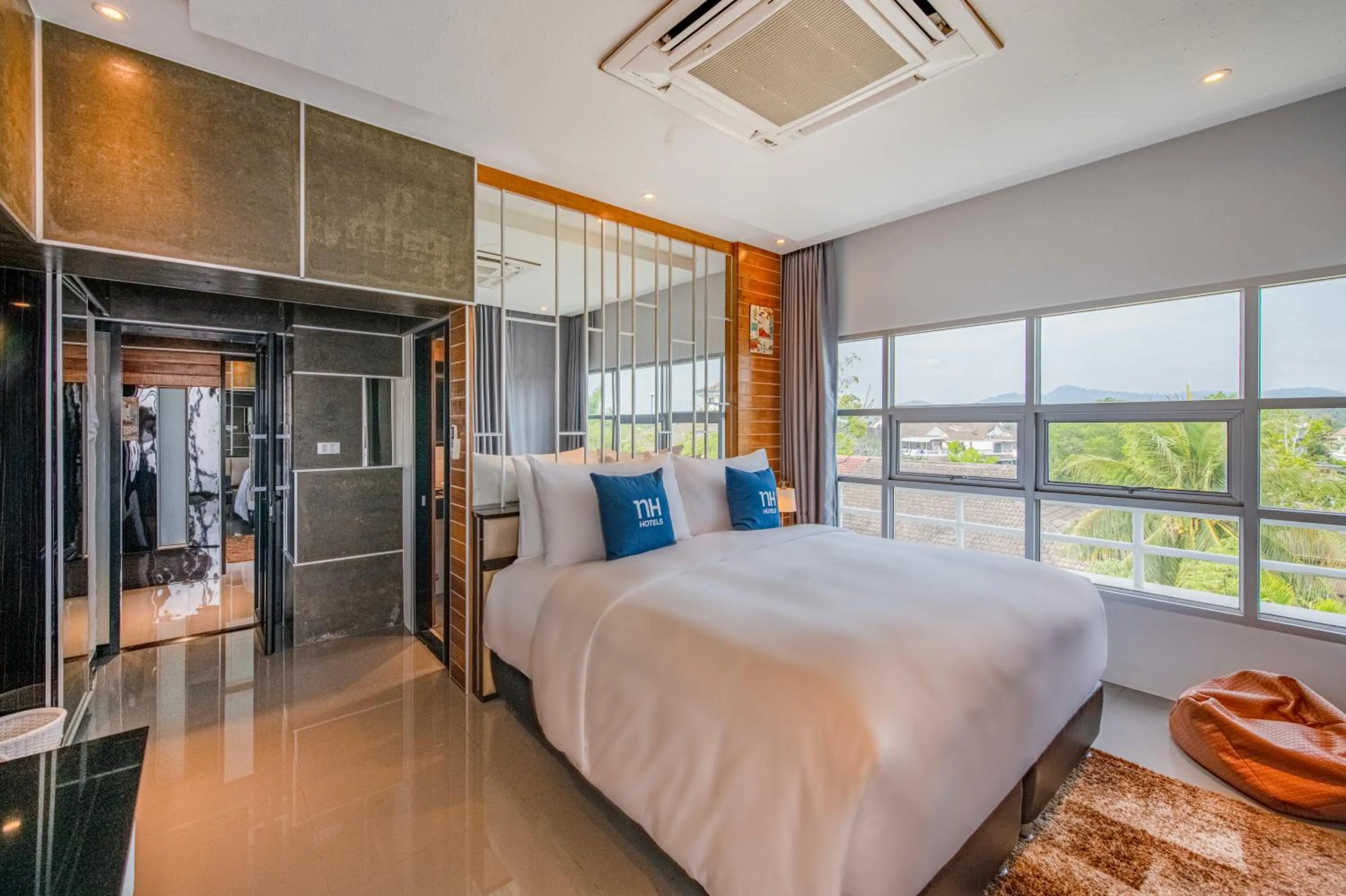 Bed in NH Boat Lagoon Phuket Resort