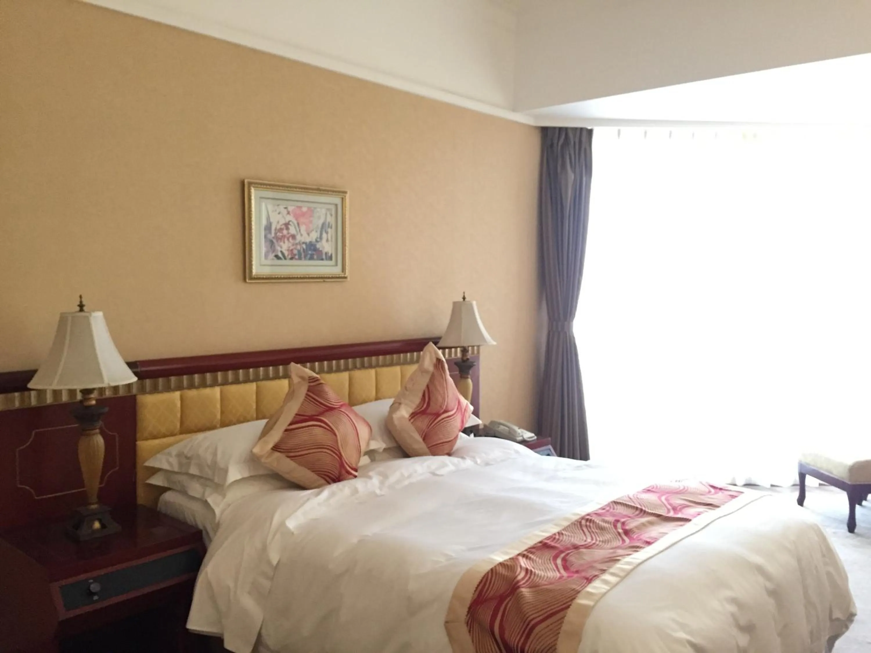 Bed in Huiquan Dynasty Hotel Qingdao