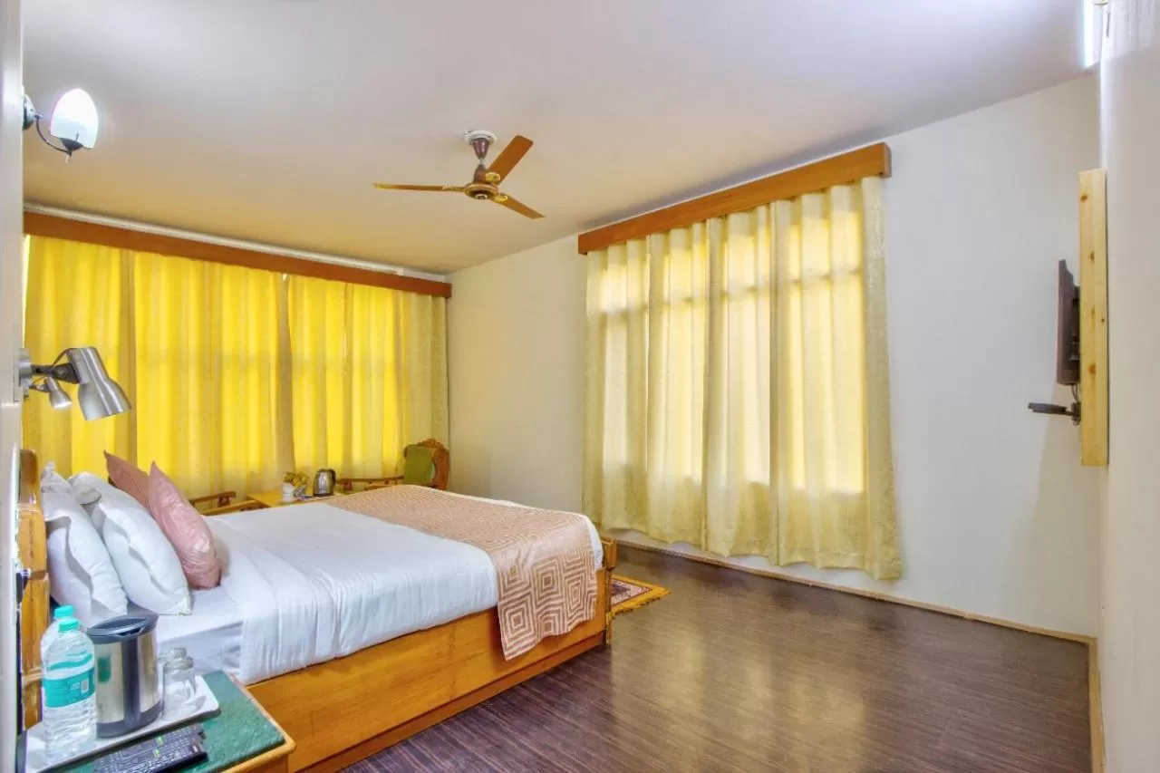 Bed in Ayushman Hotels