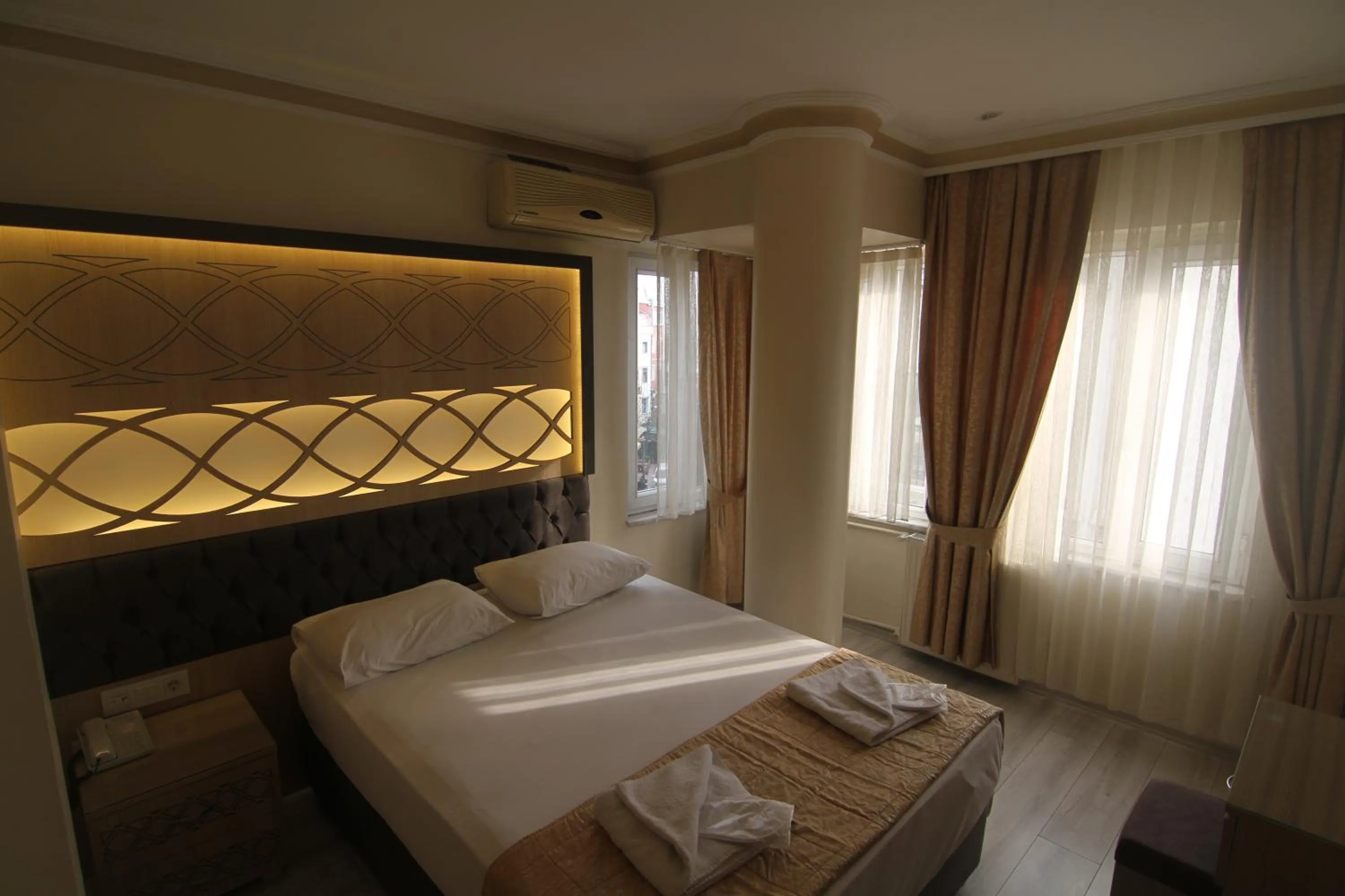 Bed in Grand Liza Hotel