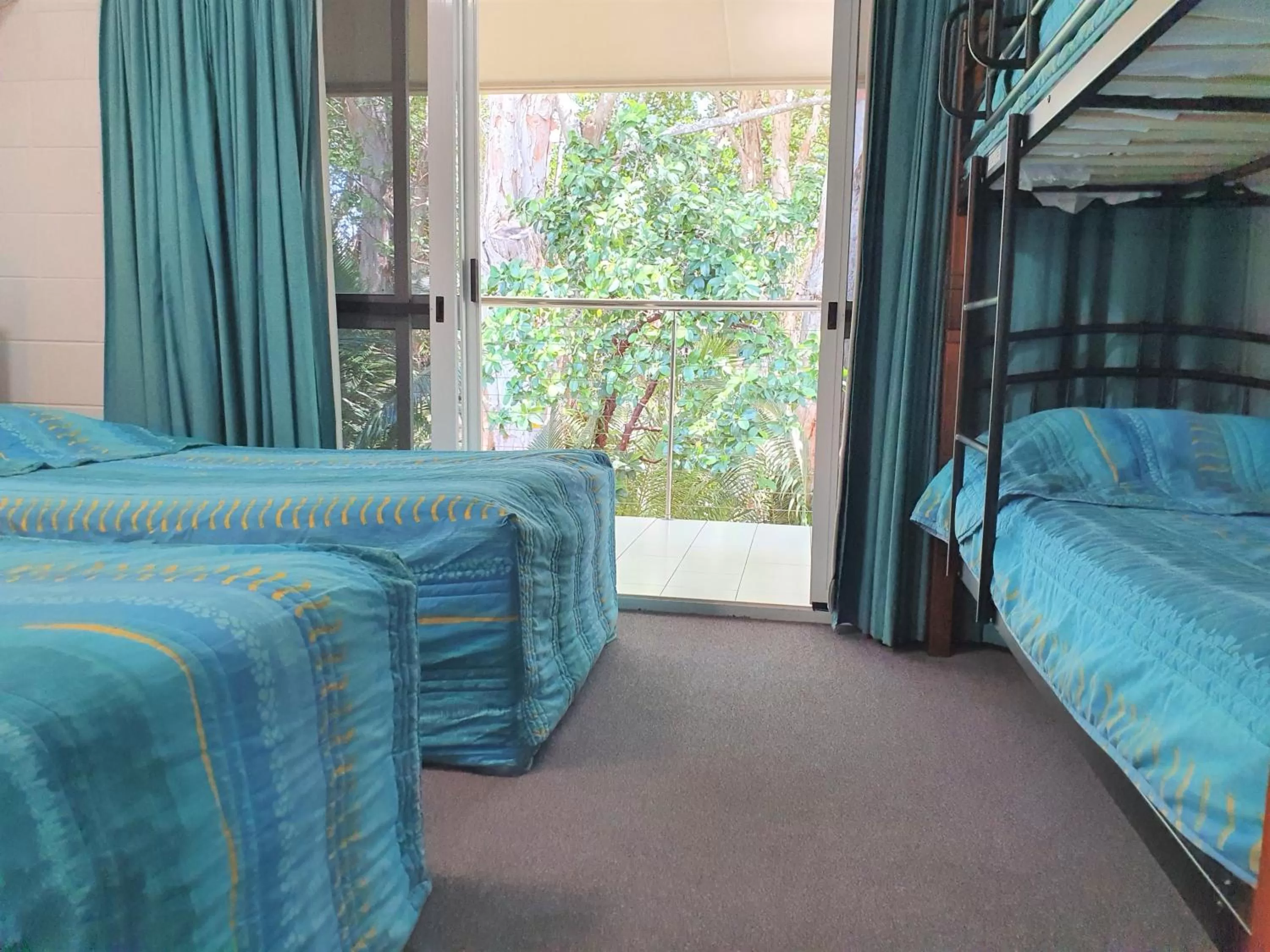 Bed in Mango Tree Holiday Apartments