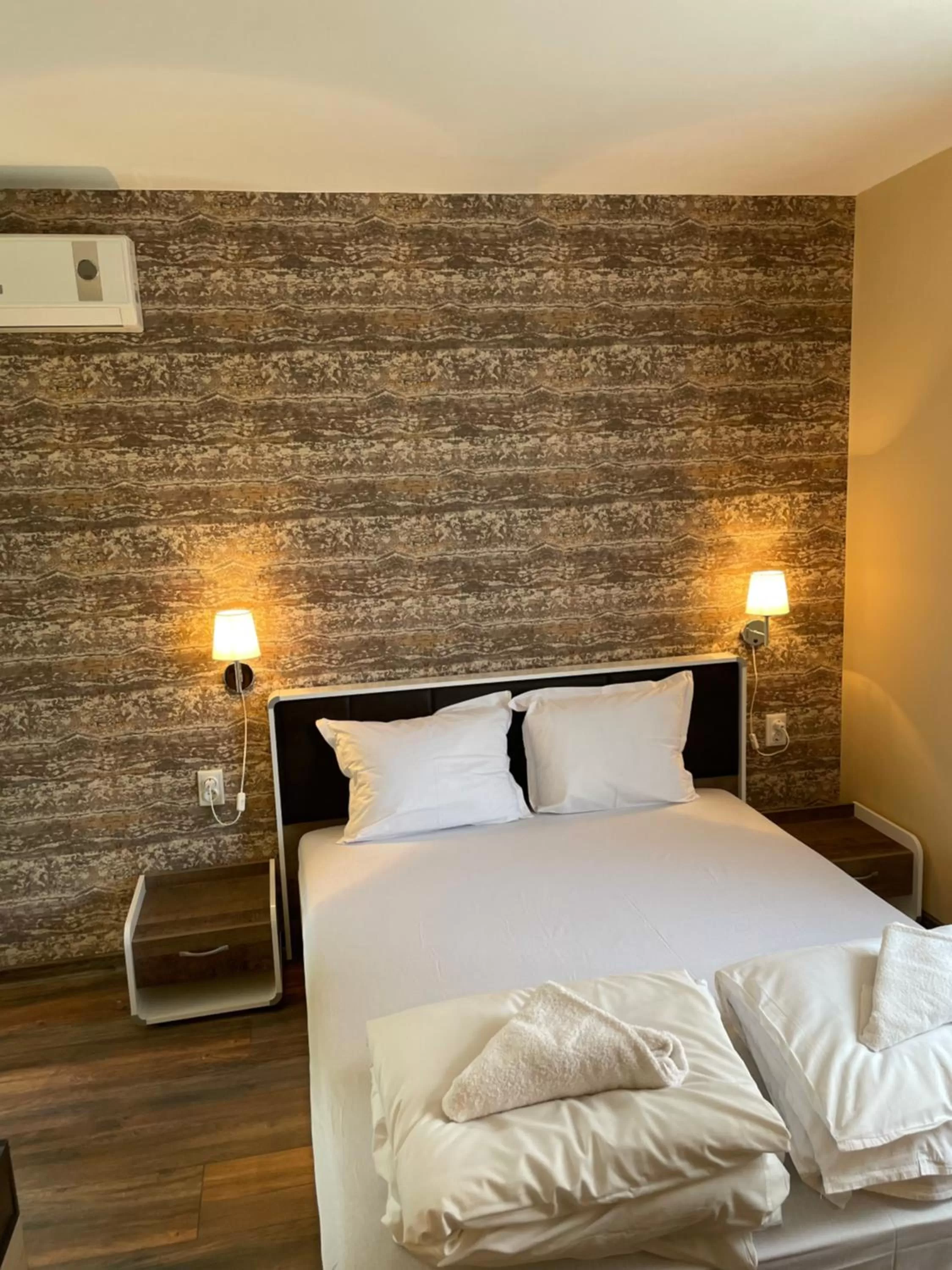 Bed in Family Hotel Malibu