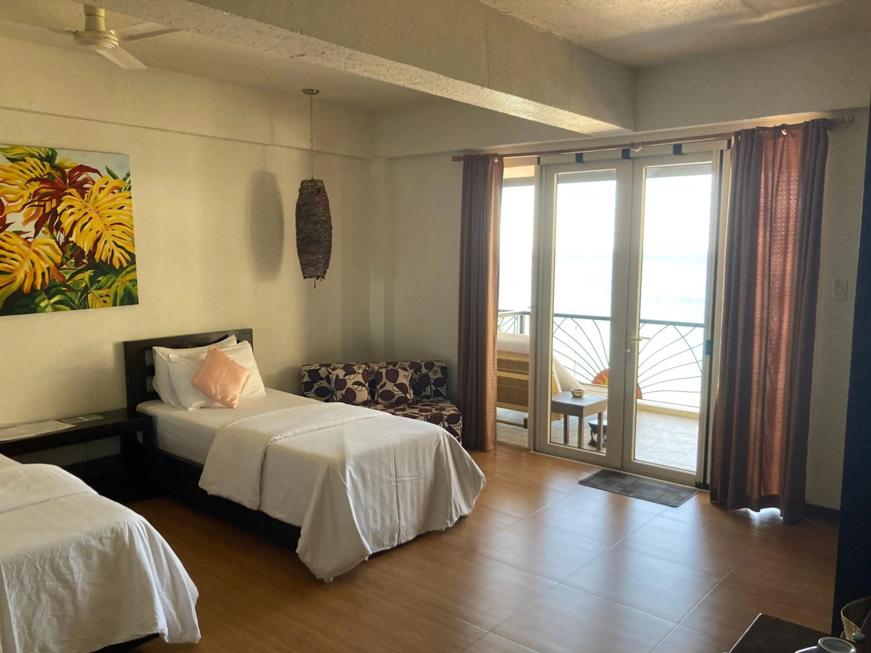 Photo of the whole room, Bed in Sunset At Aninuan Beach Resort