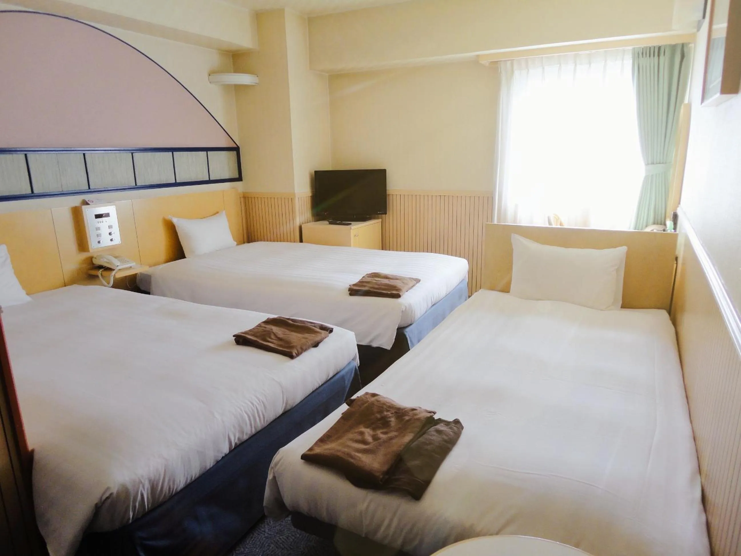 Bed in Hotel Marutani