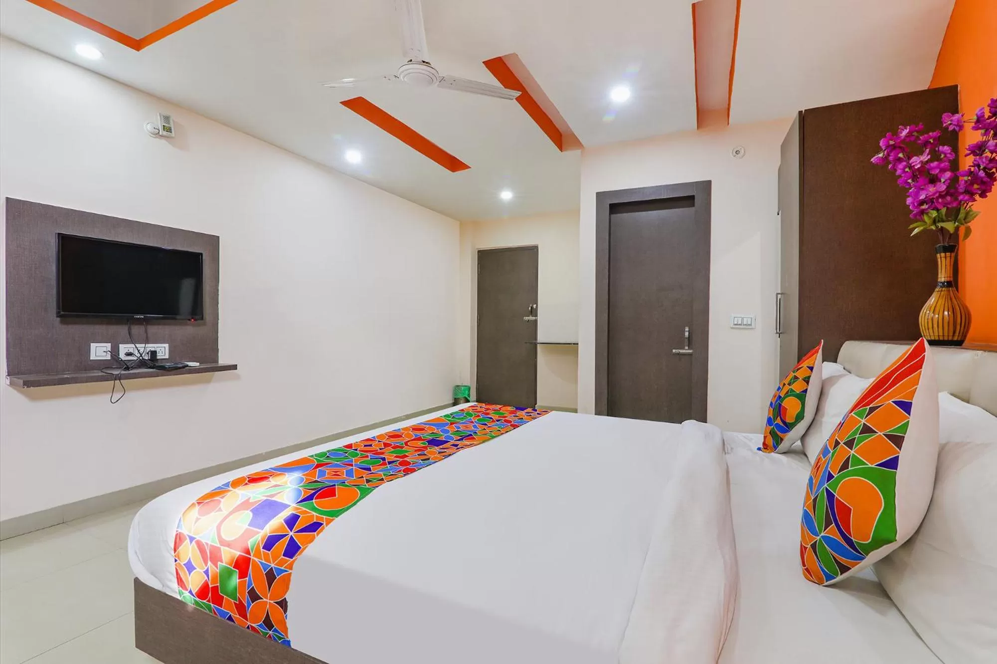 Bed in FabHotel Vinayaka