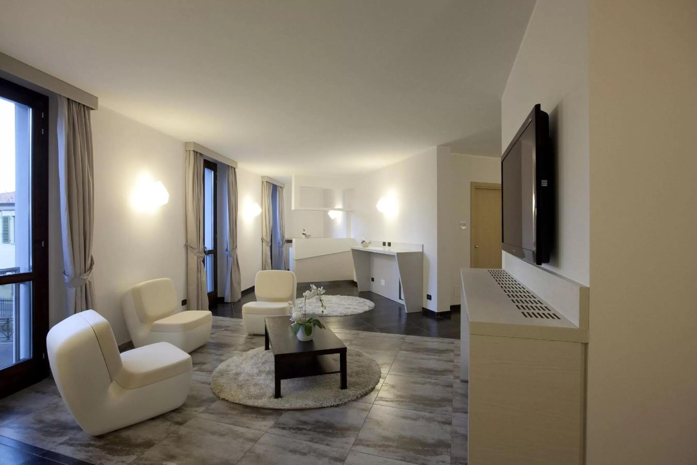 Communal lounge/ TV room in Hotel La Meridiana