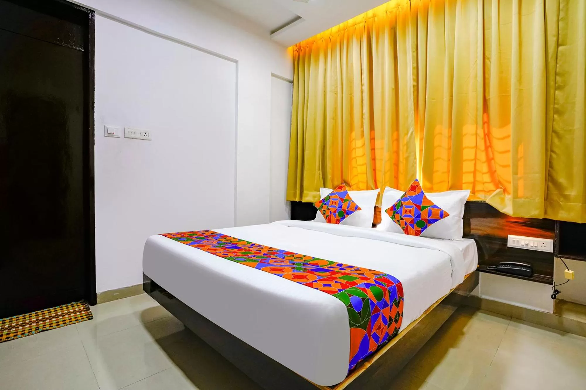 Bed in FabHotel Woods Regency