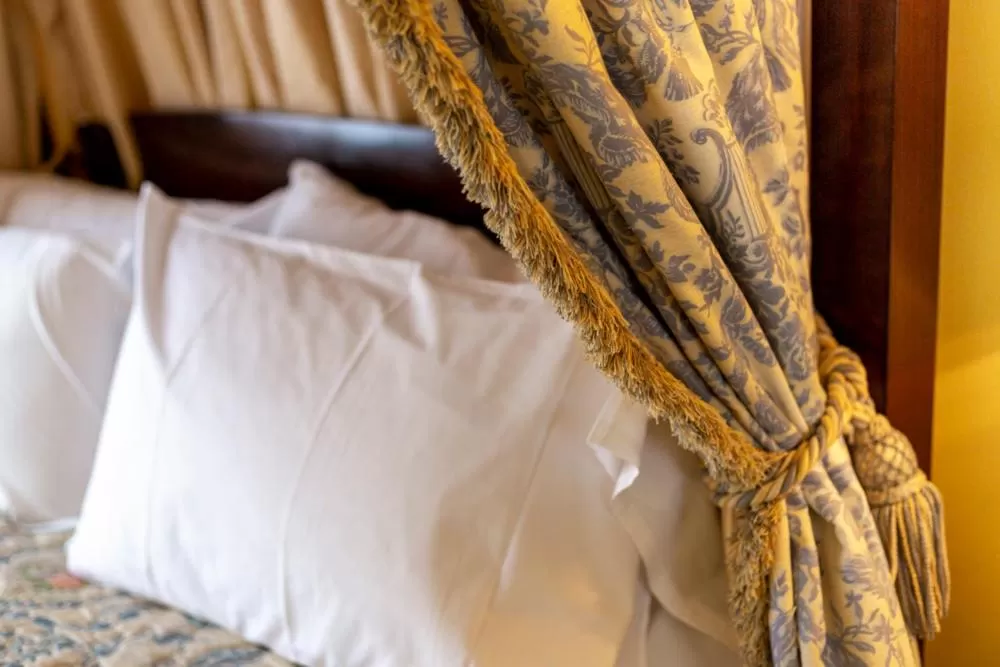 Bed in Angel and Royal Hotel