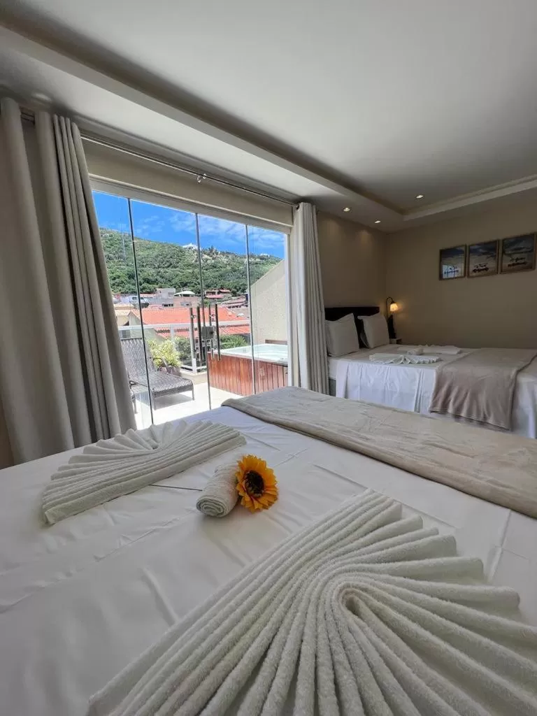 Bed in Pousada Arraial Tropical