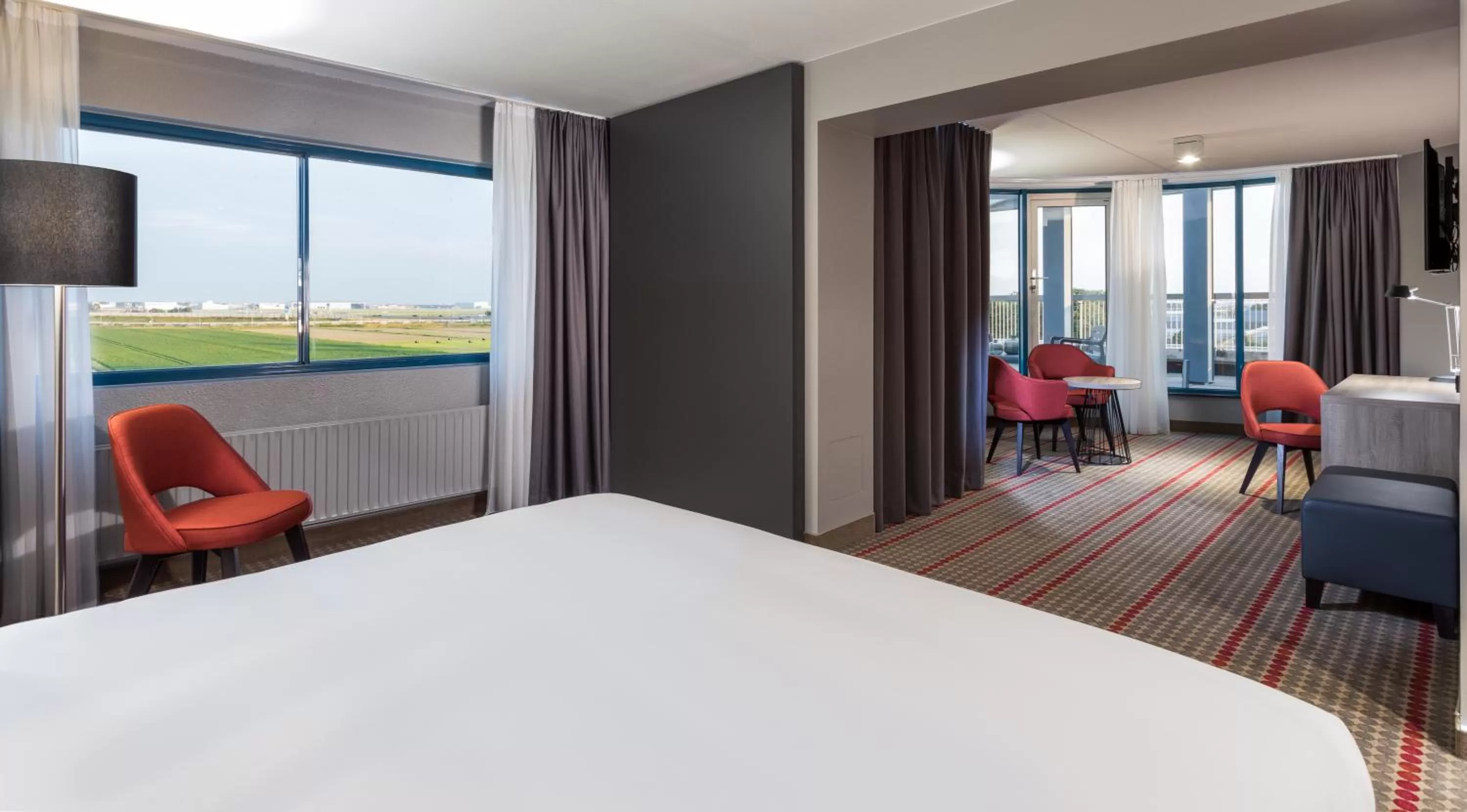Balcony/Terrace, Bed in Ramada by Wyndham Amsterdam Airport Schiphol