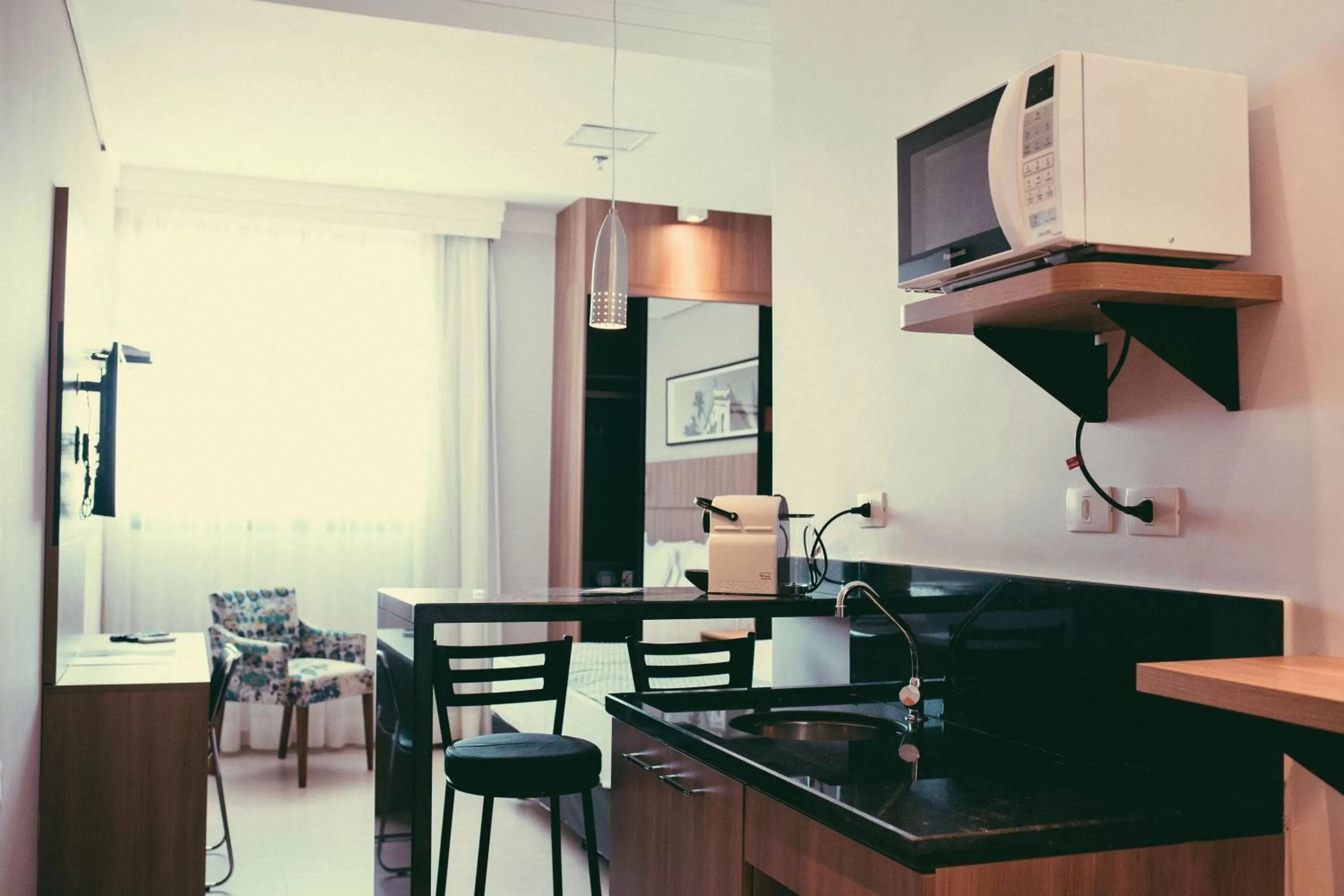 Communal kitchen in Occitano Apart Hotel