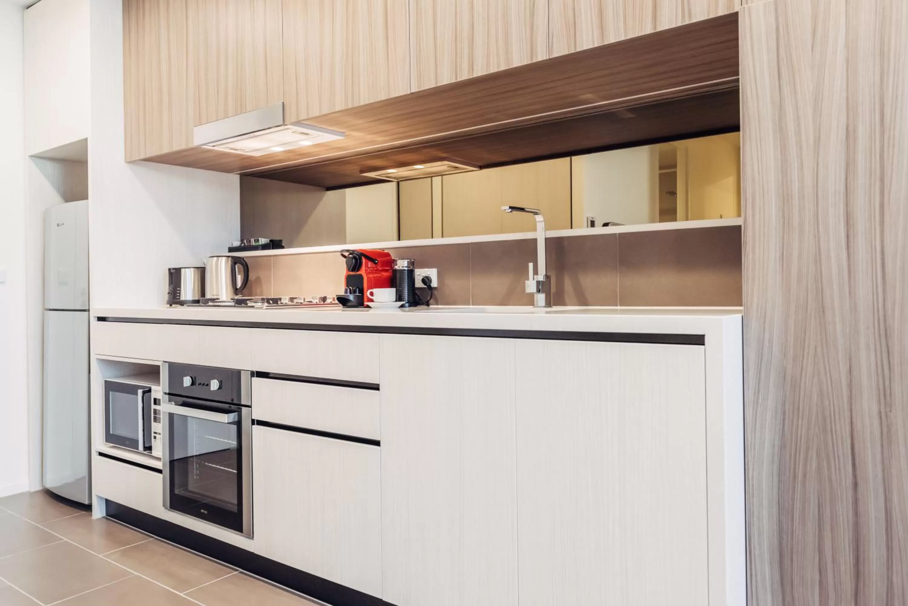 Kitchen or kitchenette in Comfort Apartments Box Hill