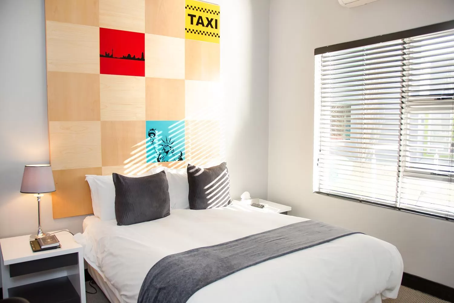 Bed in City Living Boutique Hotel