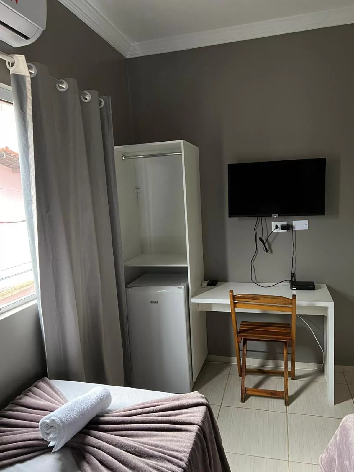 TV/Entertainment Center in Pousada Praia Bela