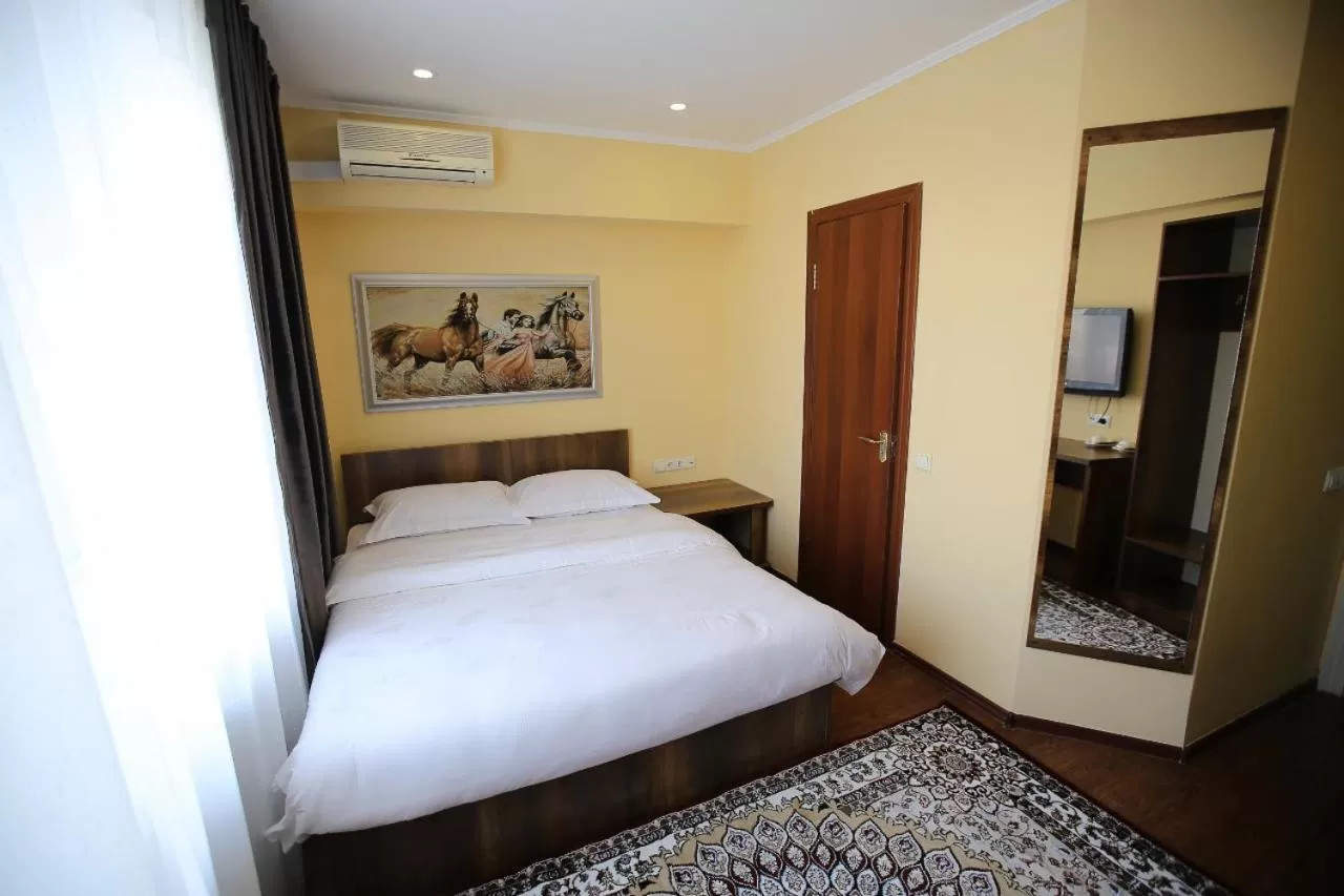 Bed in Altai Business Hotel