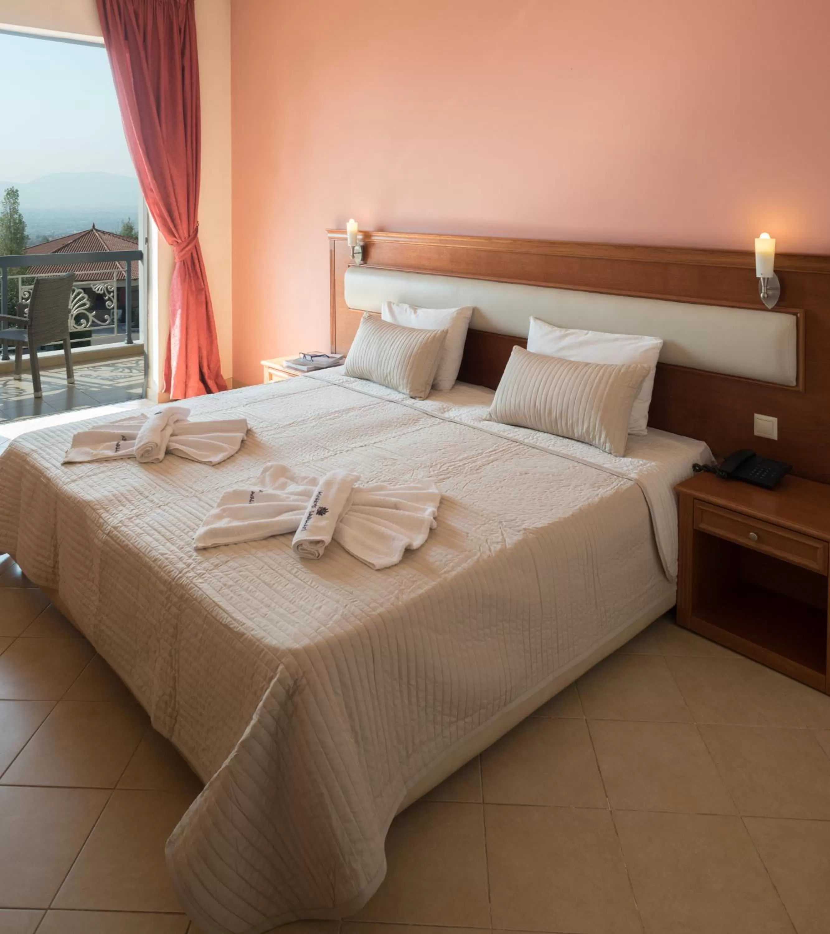 Bed in Acharnis Kavallari Hotel Suites