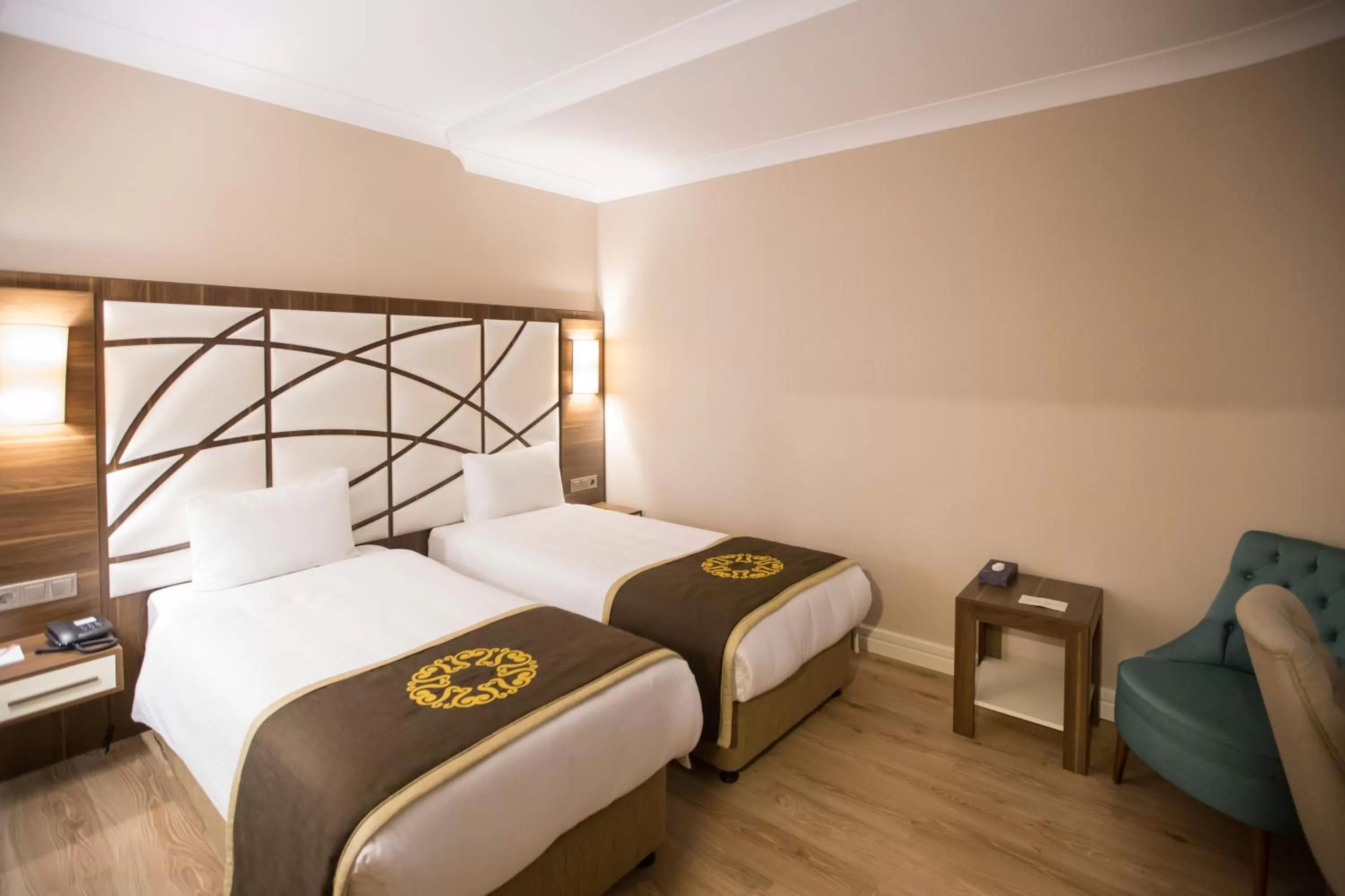 Bed in The Grand Mira Business Hotel