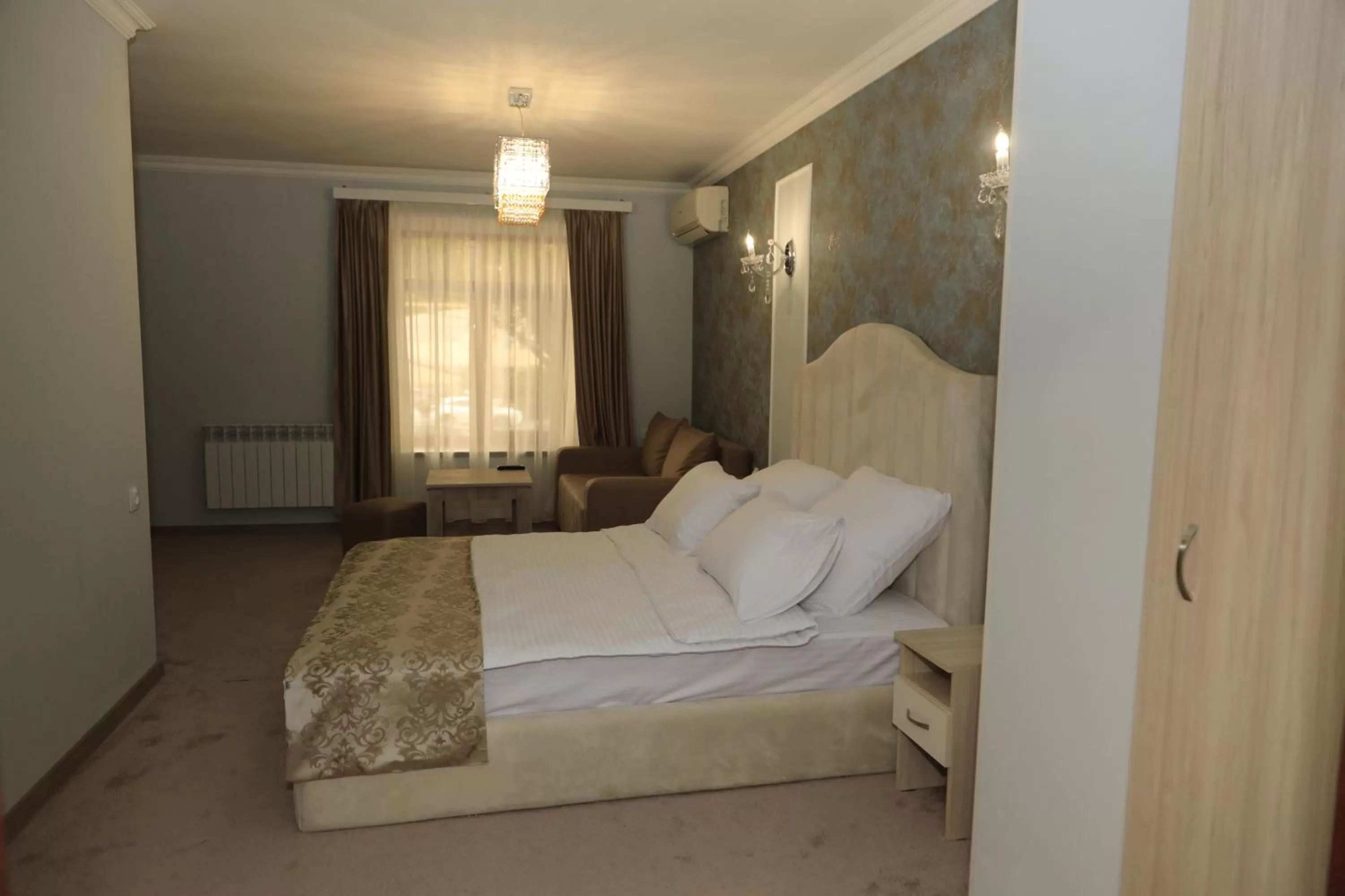 Bed in DeLin Hotel And Tours