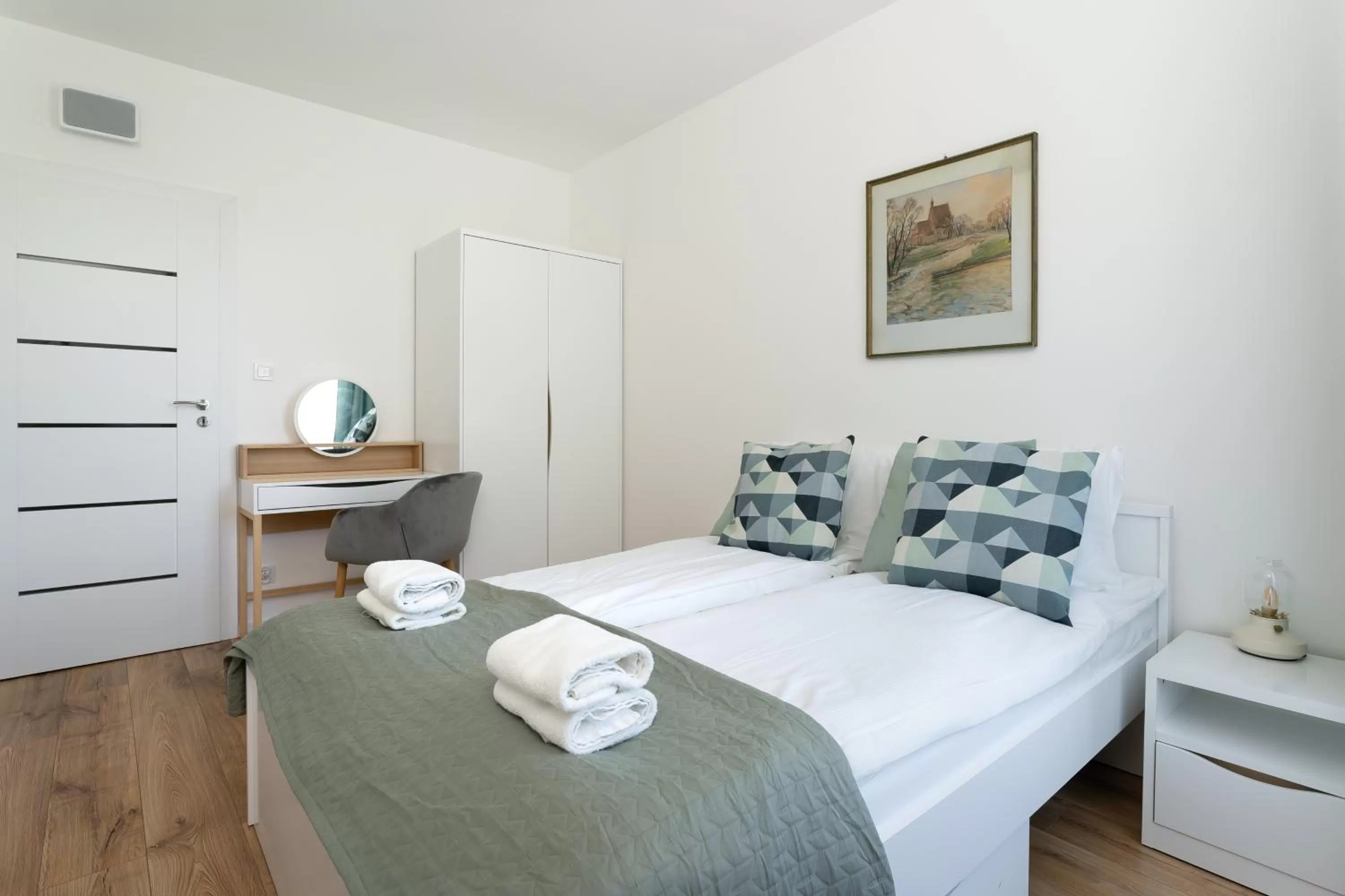 Bed in Symphony Modern Tower Apartamenty