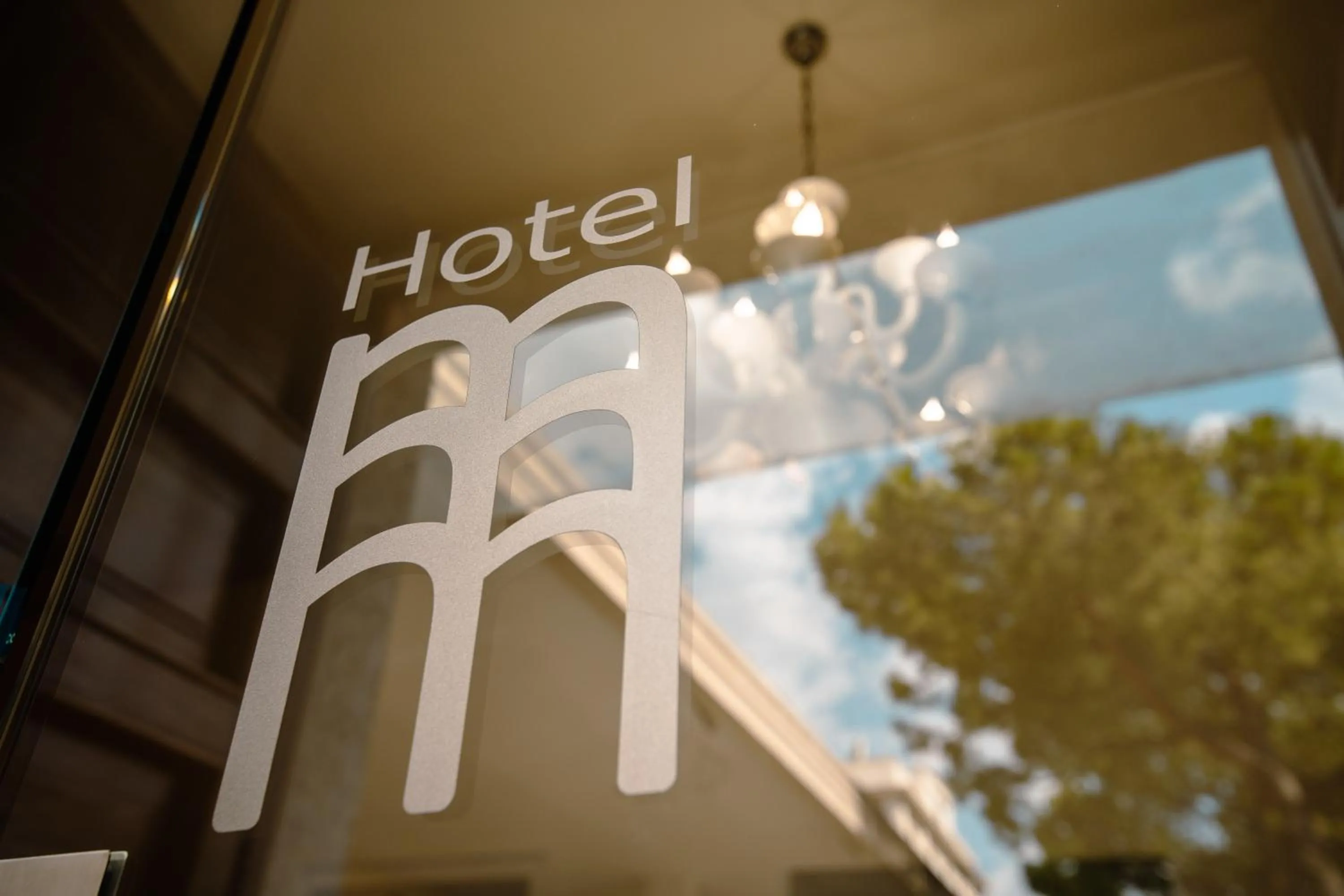 Property logo or sign in Hotel Bruman Salerno