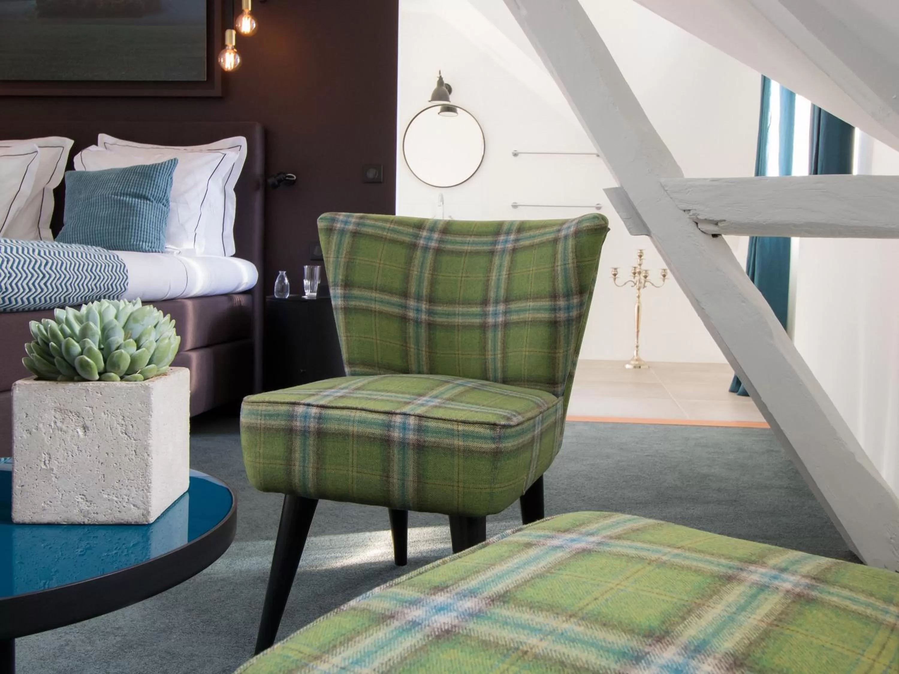 Living room, Bed in Hôtel-Restaurant Bel Ami