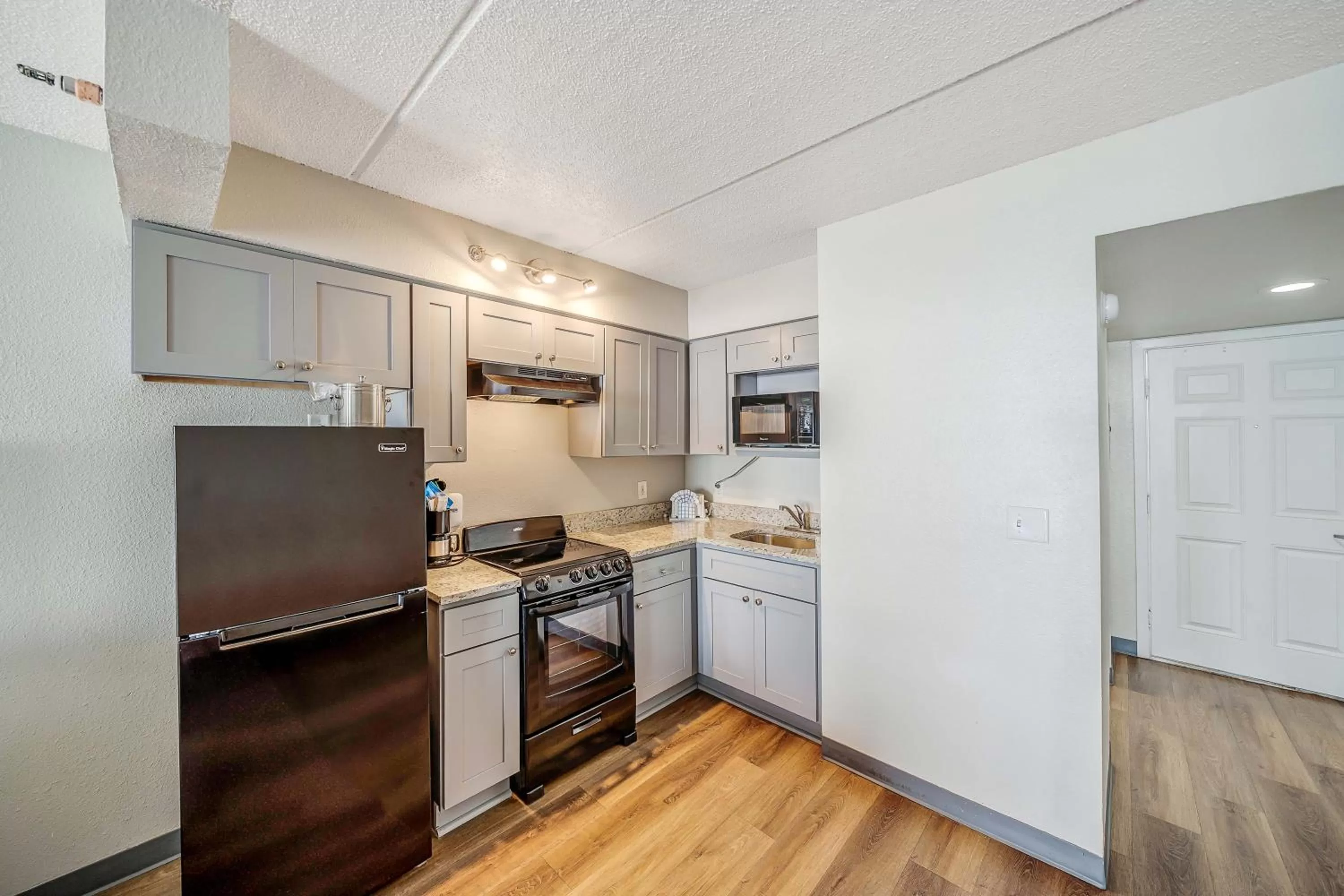 kitchen in Sugar Sands Beachfront Hotel, a By The Sea Resort