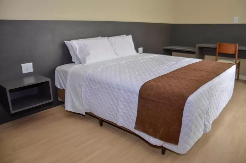 Bed in M Tower Hotel