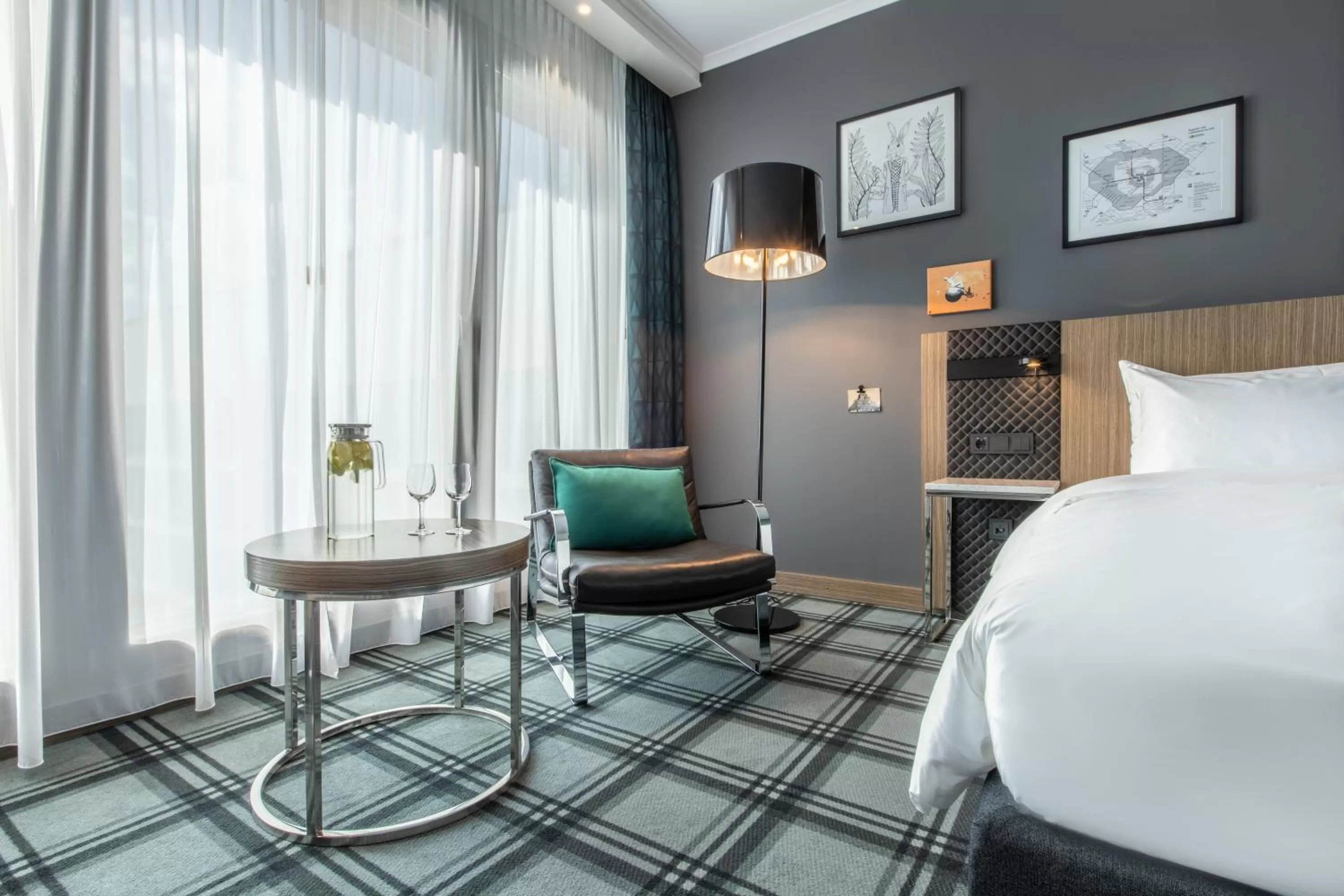 Seating area, Bed in Radisson Blu Hotel Hannover