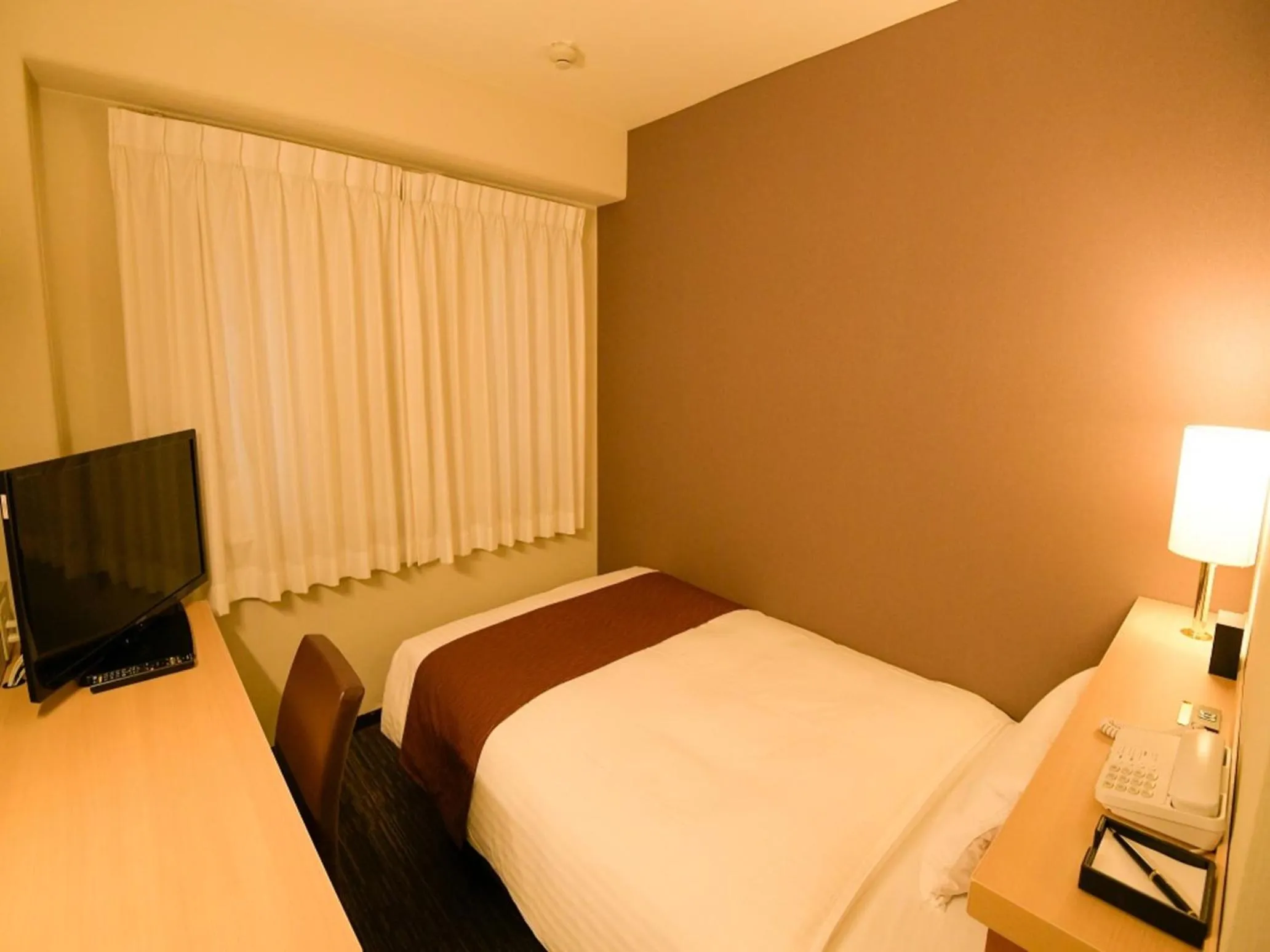 Bed in Via Inn Shin Osaka West