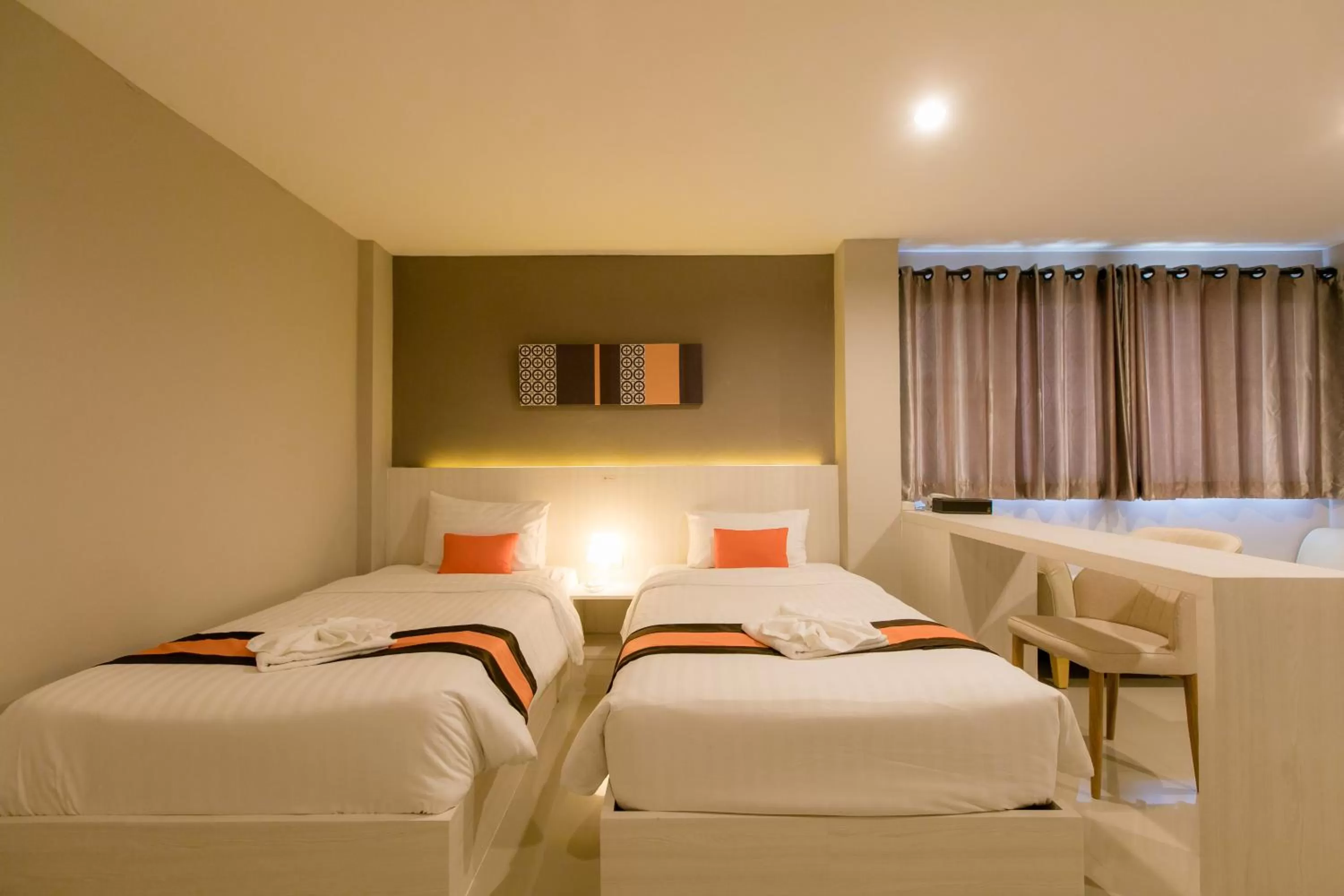 Bed in De Hug Hotel & Residence