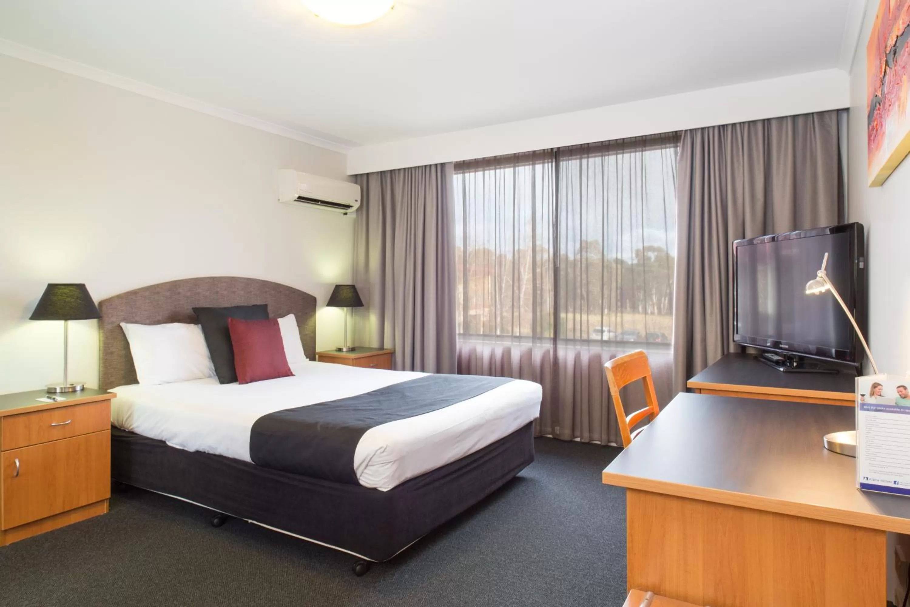 Bed in Alpha Hotel Canberra