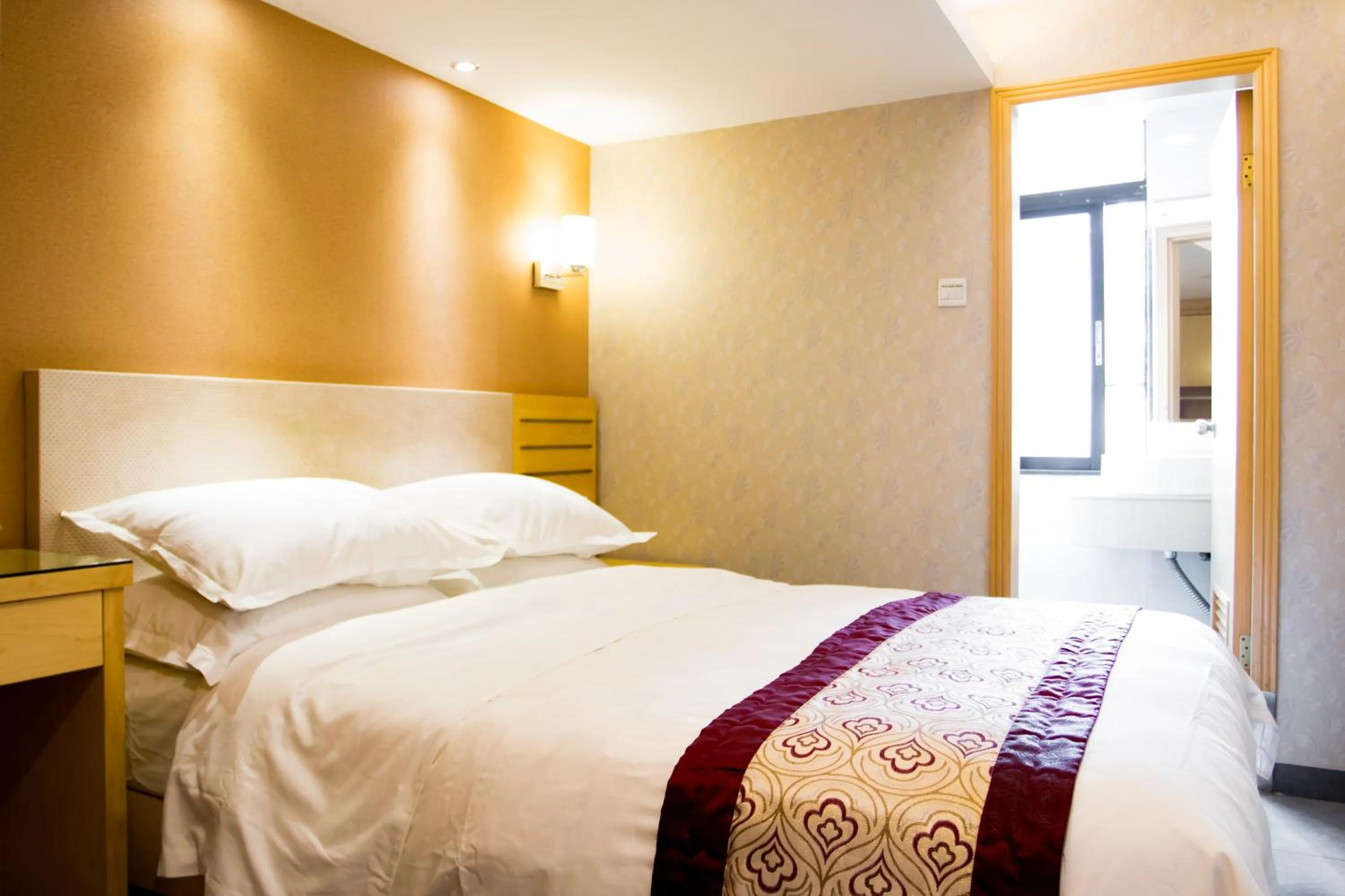 Bed in Guang Dong Hotel