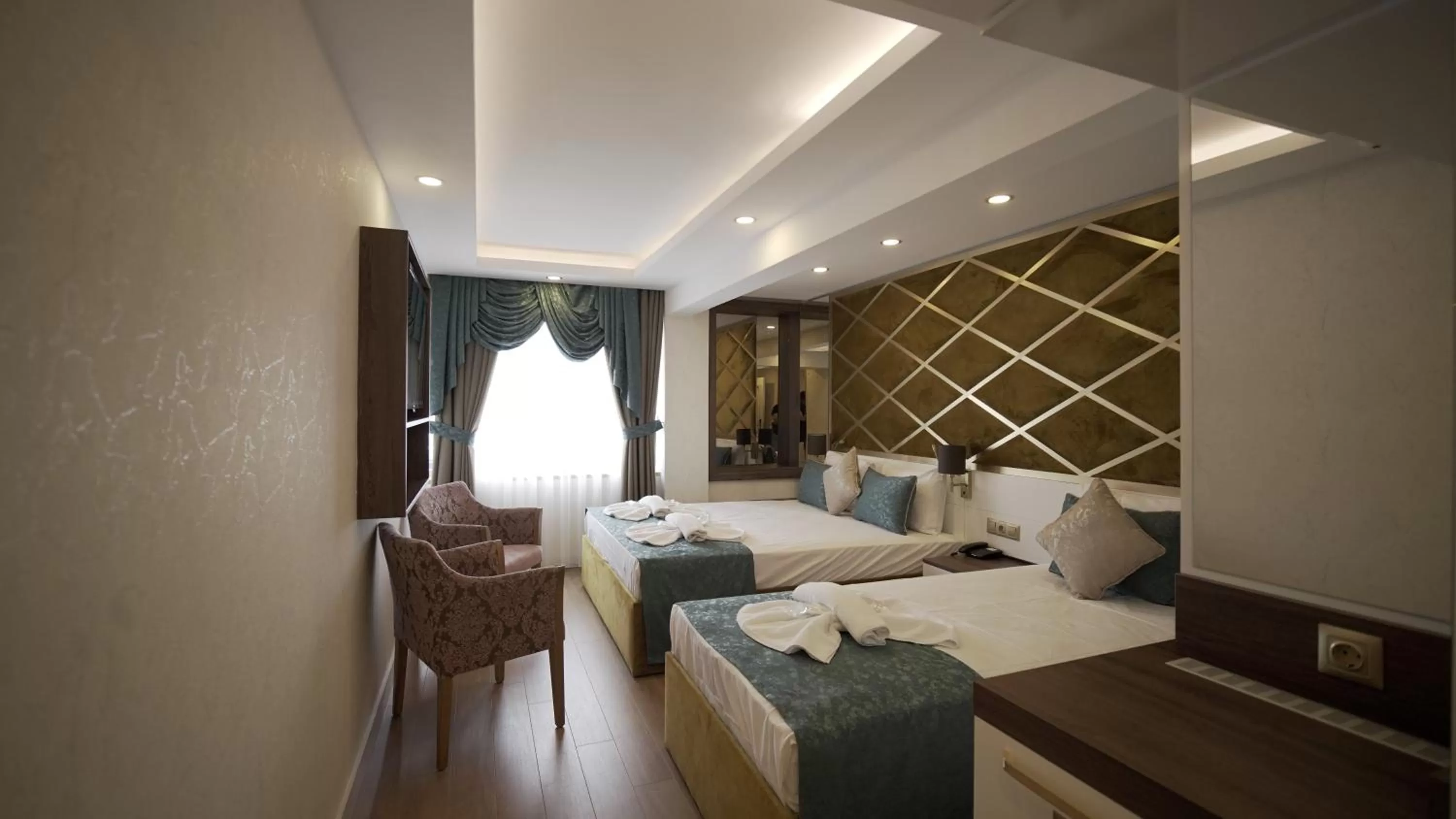Photo of the whole room, Bed in Burj Al Istanbul