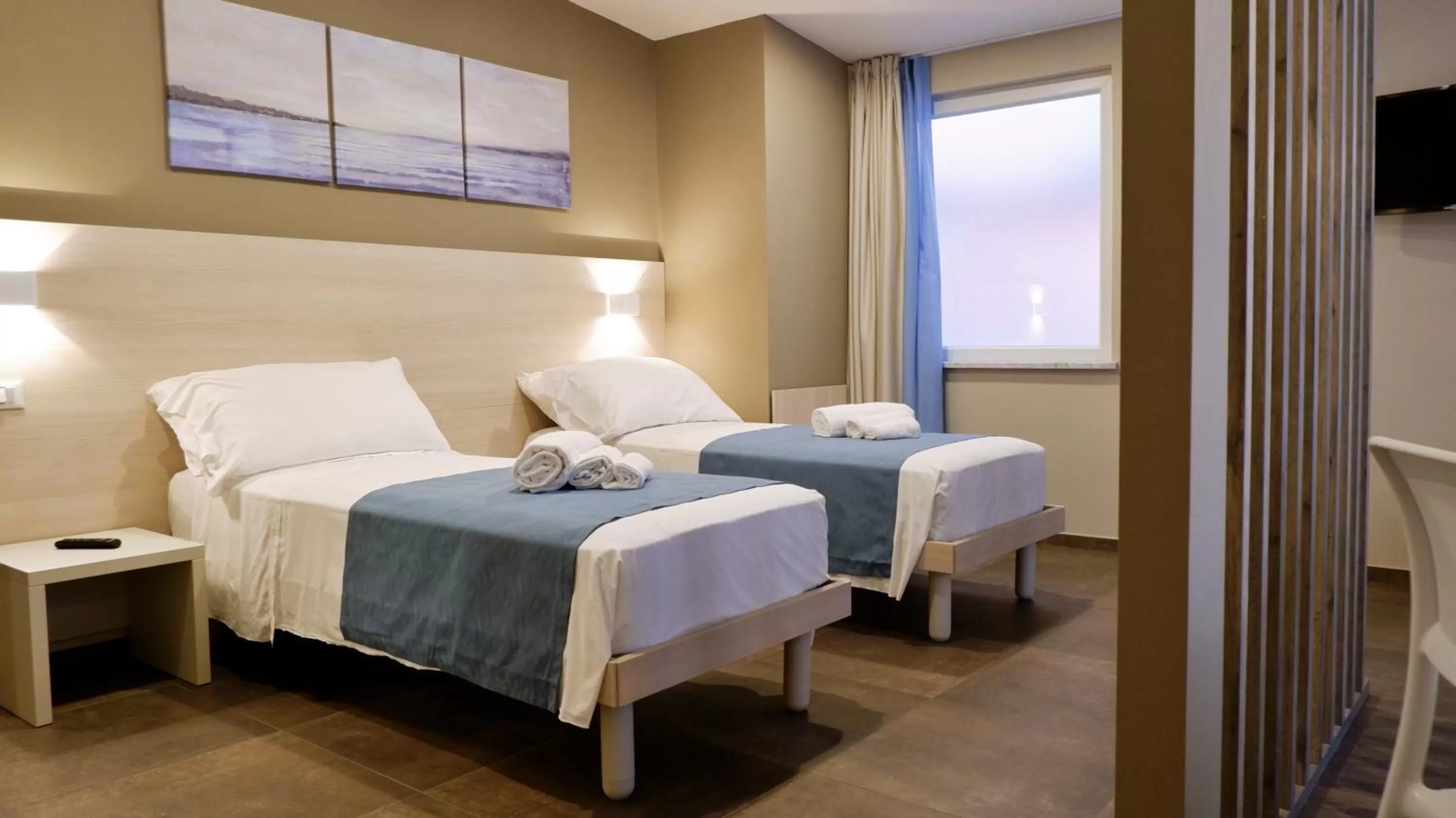 Bed in Pianomare Riviera Apartments and Rooms