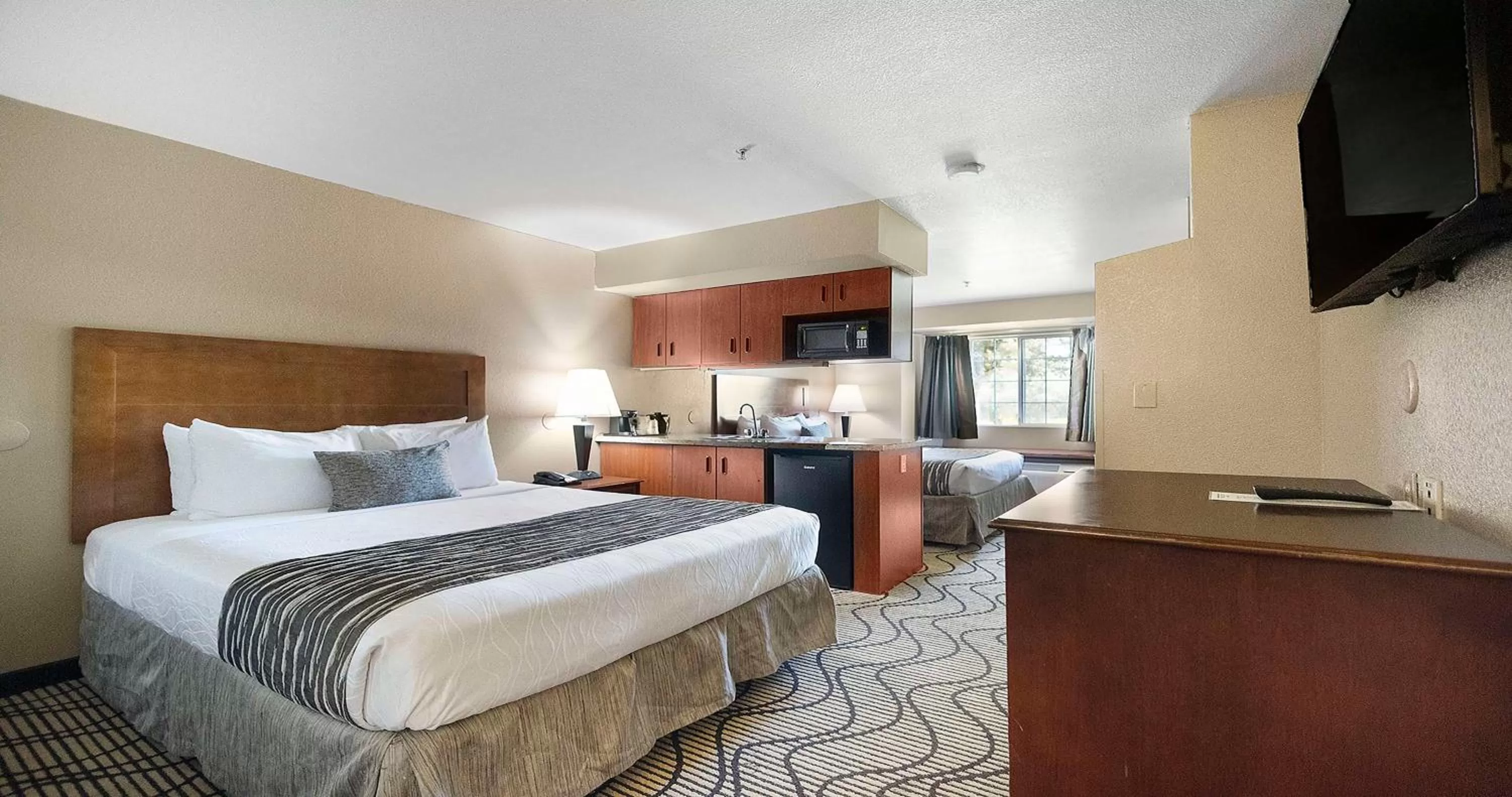Queen Room with Two Queen Beds and Wet Bar in SureStay Plus Hotel by Best Western Rocklin