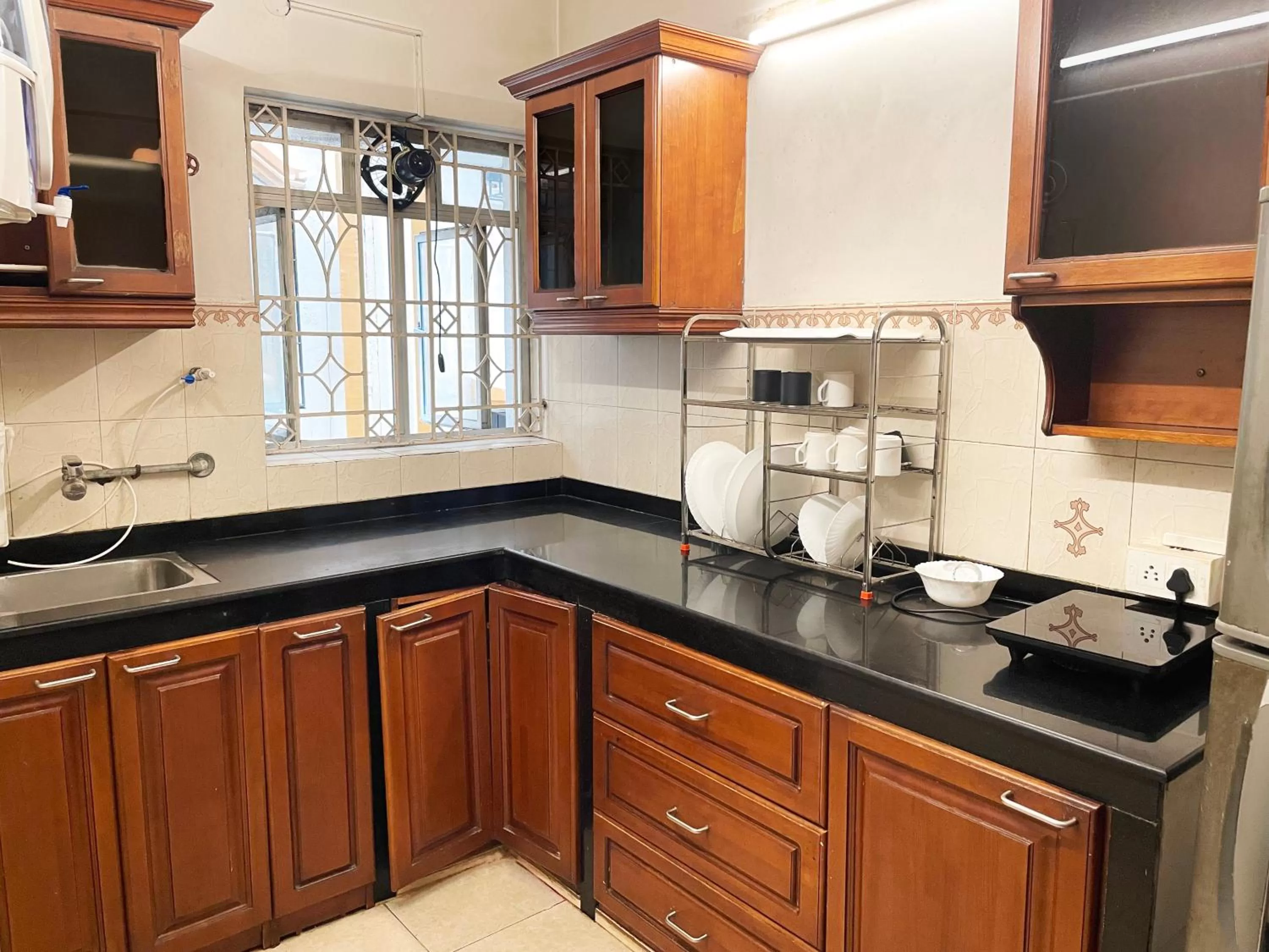 Kitchen/Kitchenette in The Aster Homestay - Bedrooms & Apartments