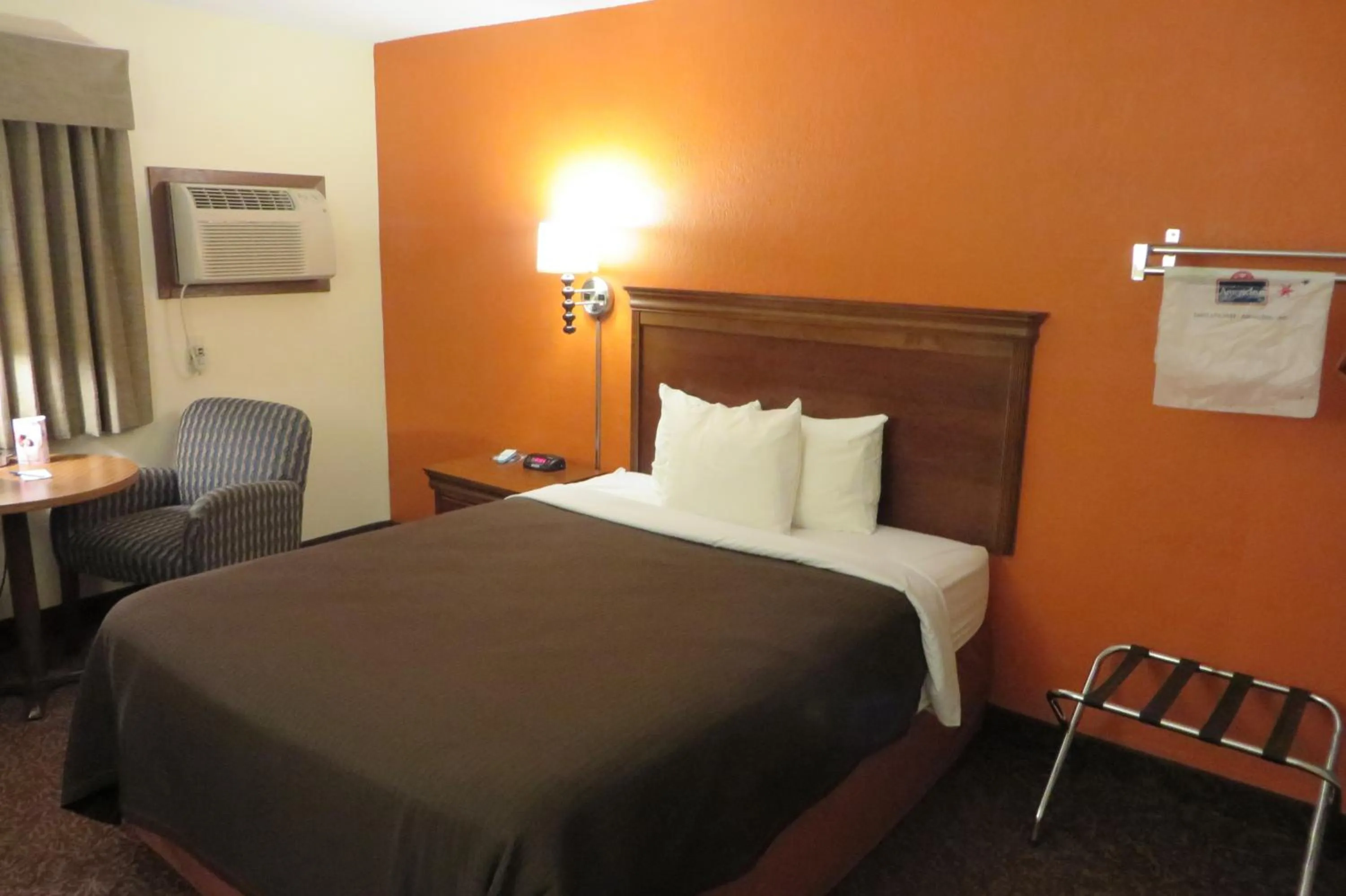 Bed in AmericInn by Wyndham Forest Lake