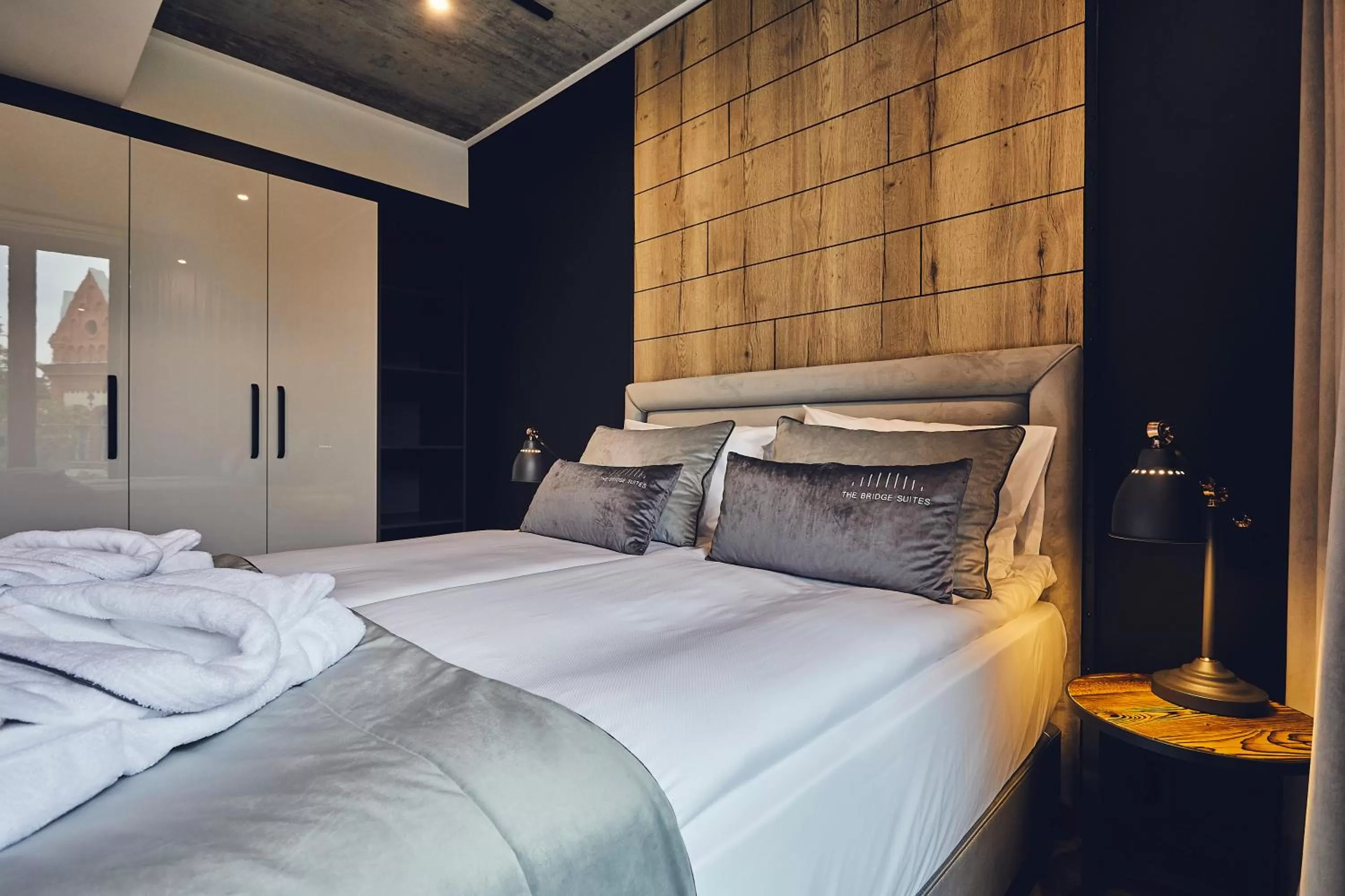 Bed in The Bridge Suites Hotel