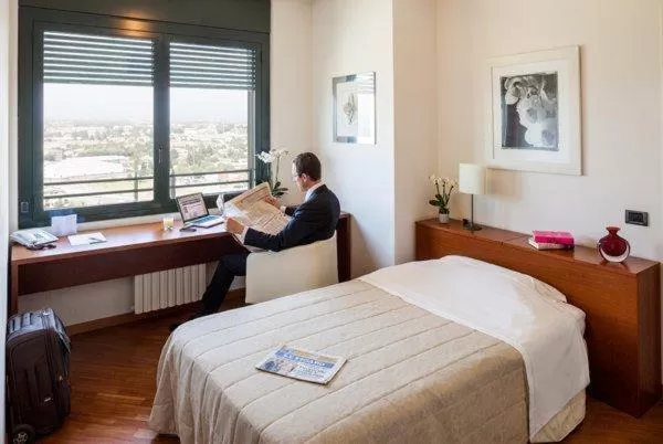 Bed in Cosmo Hotel Torri