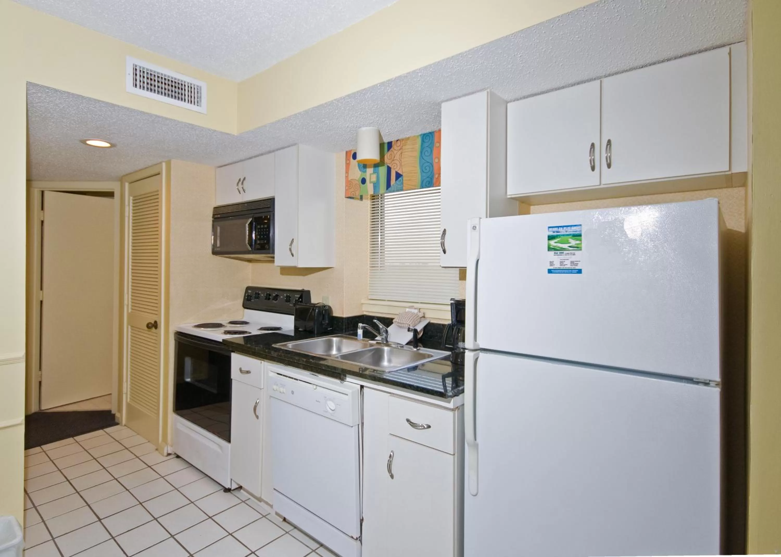 Kitchen or kitchenette in The Strand - A Boutique Resort