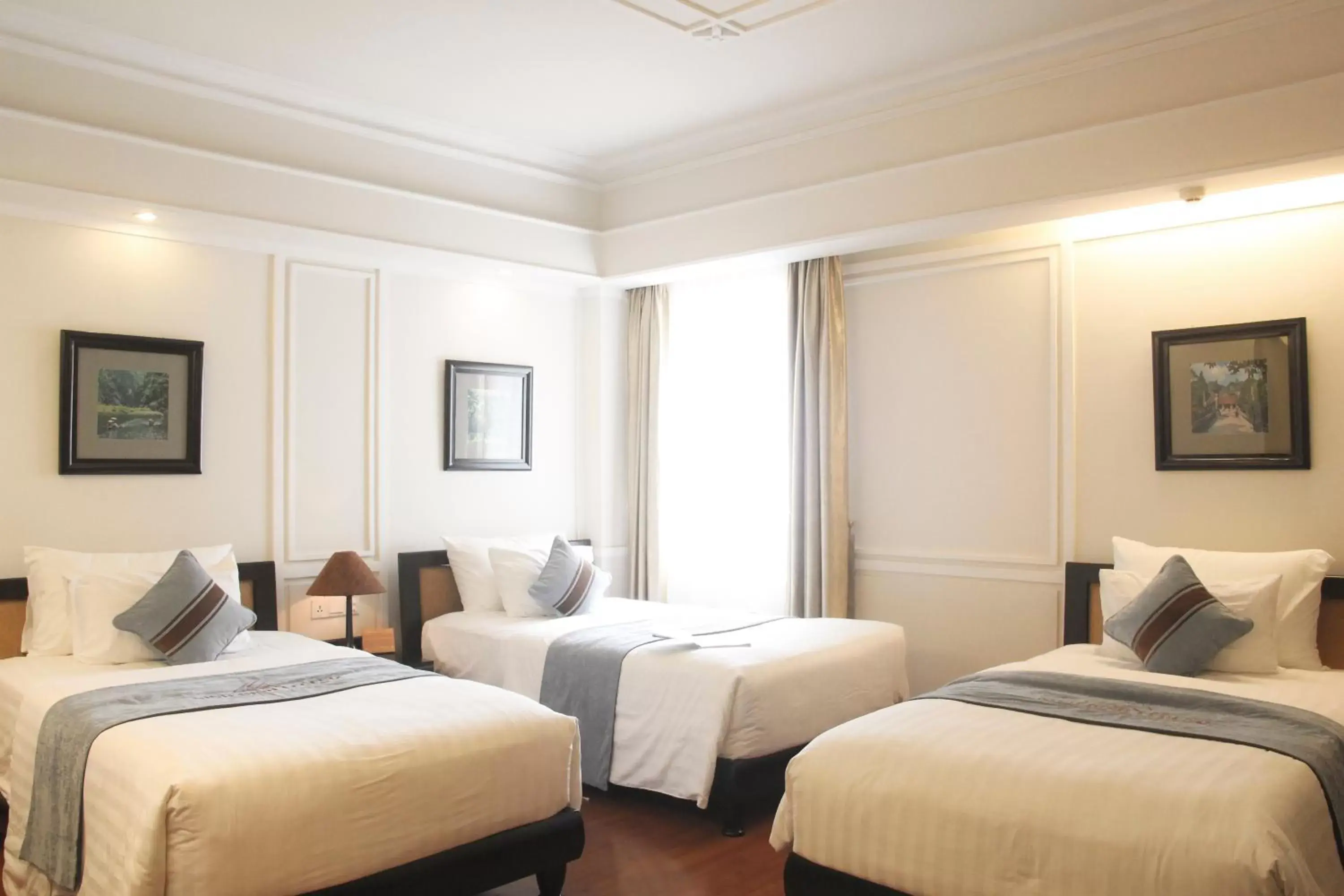 Deluxe Triple Room (French Wing) in Ninh Binh Legend Hotel Deluxe Triple Room (French Wing) in Ninh Binh Legend Hotel