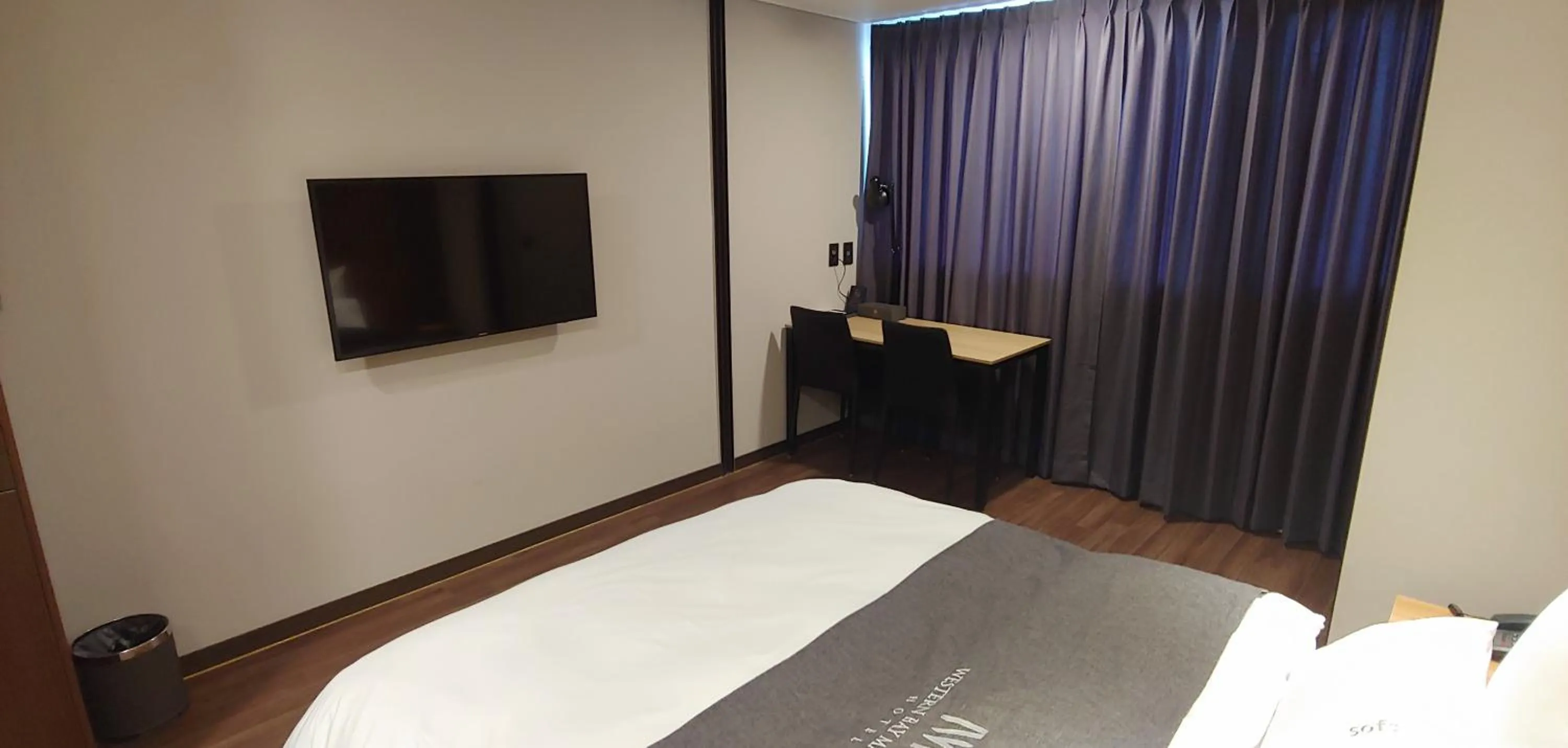 Bed in Western Bay Marina Hotel