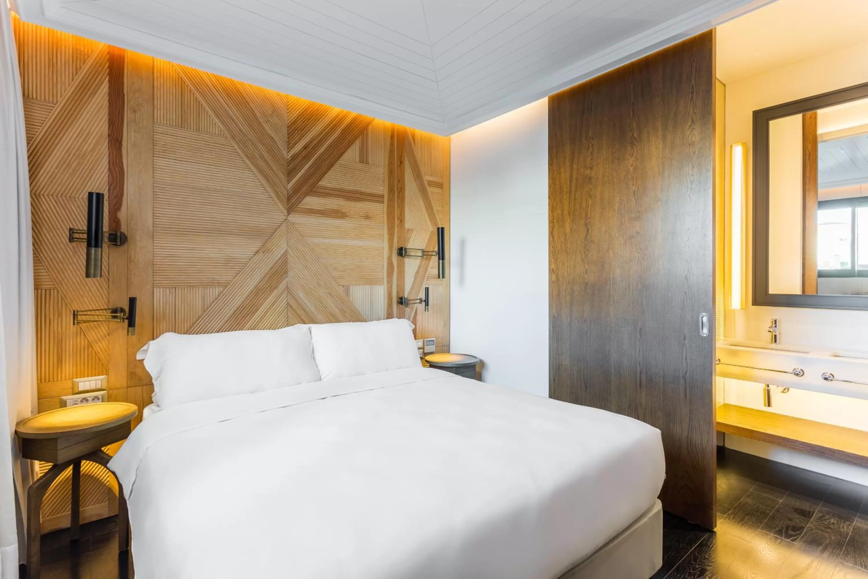 Bed in The Wings Hotels Collection