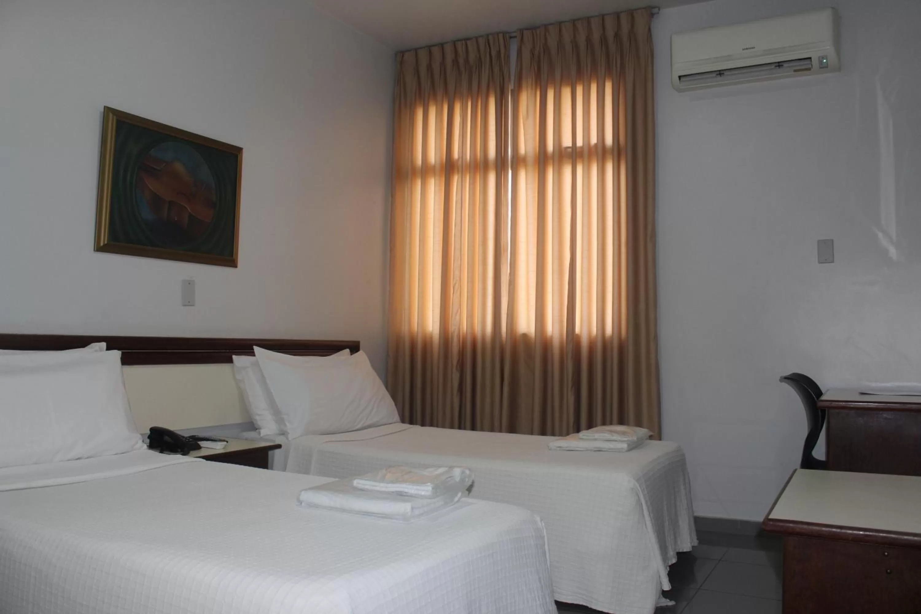 Bed in Hotel Oscar Econômico