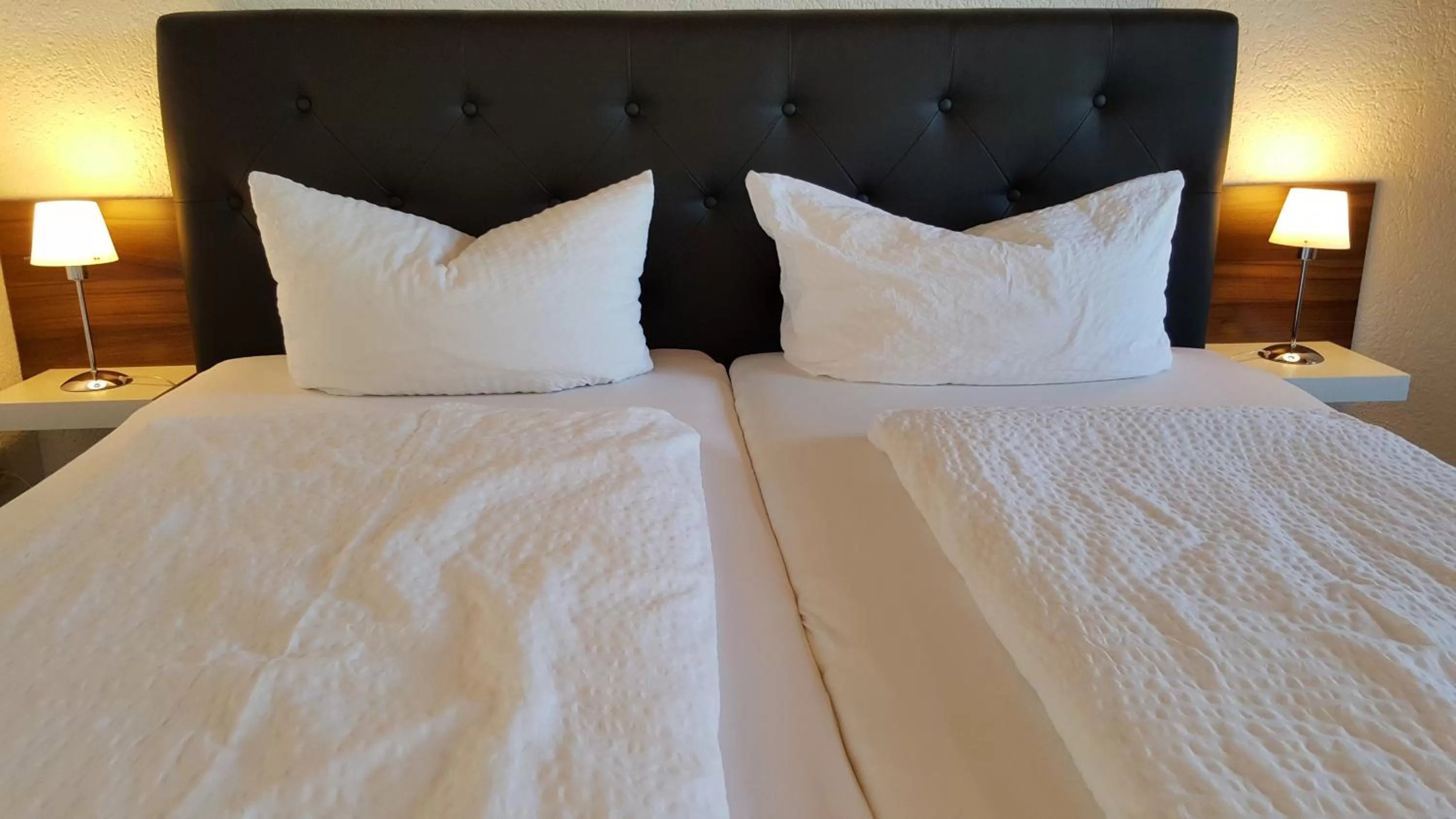 Bed in Hotel Exquisite