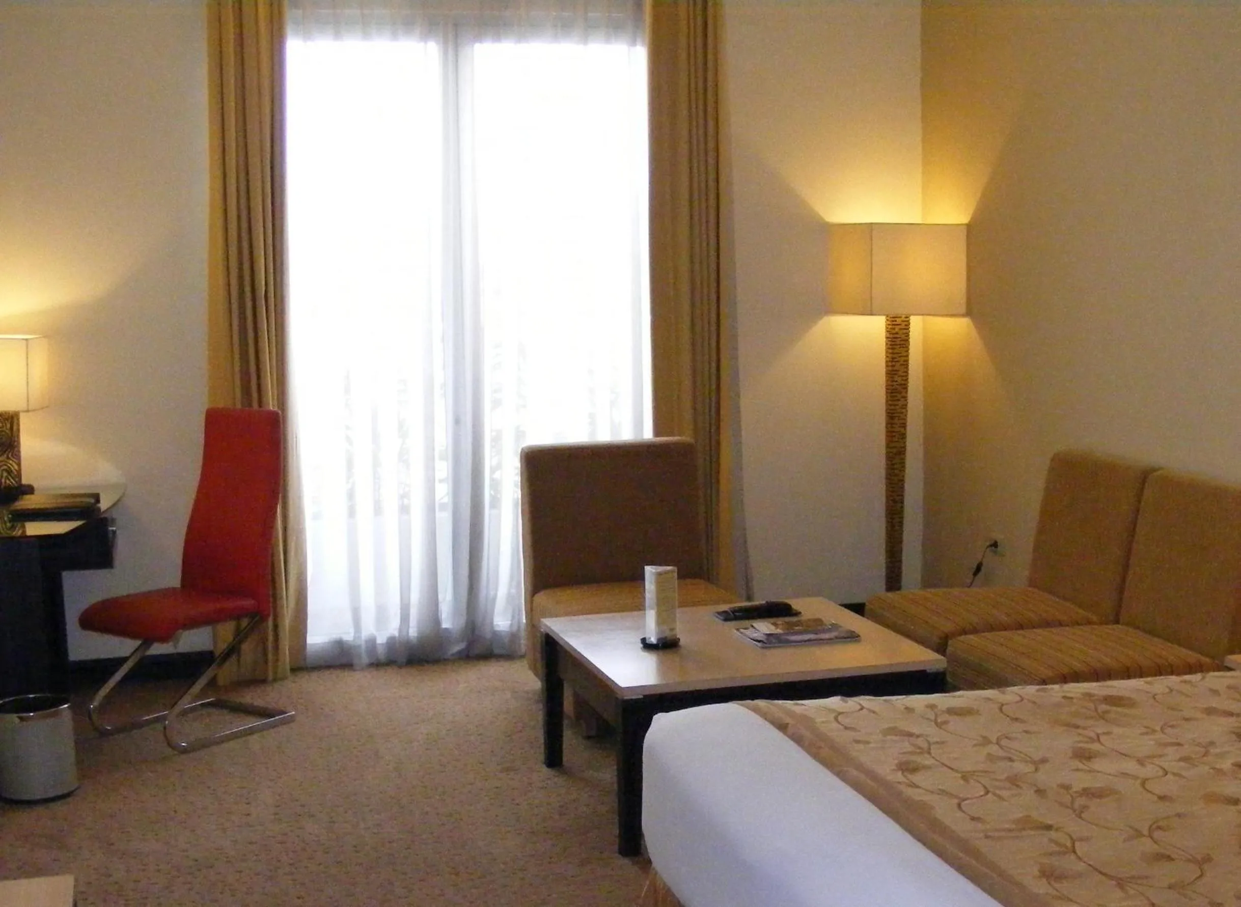 Seating area, Bed in Golden Flower by KAGUM Hotels