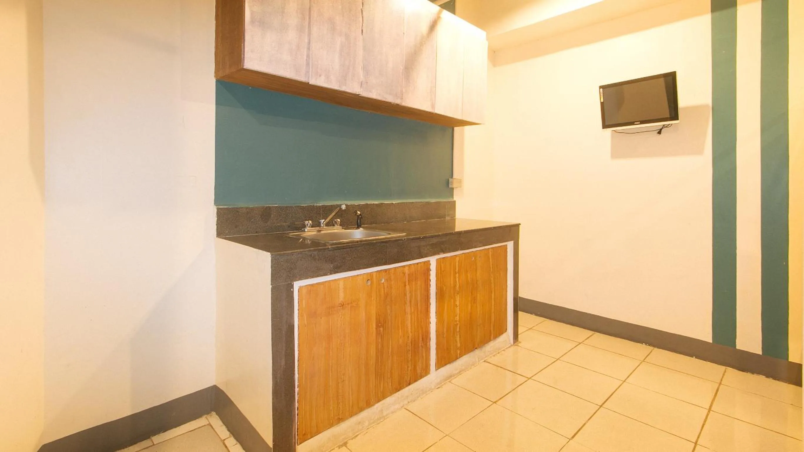 Kitchen or kitchenette in RedDoorz at Crowne One Condo