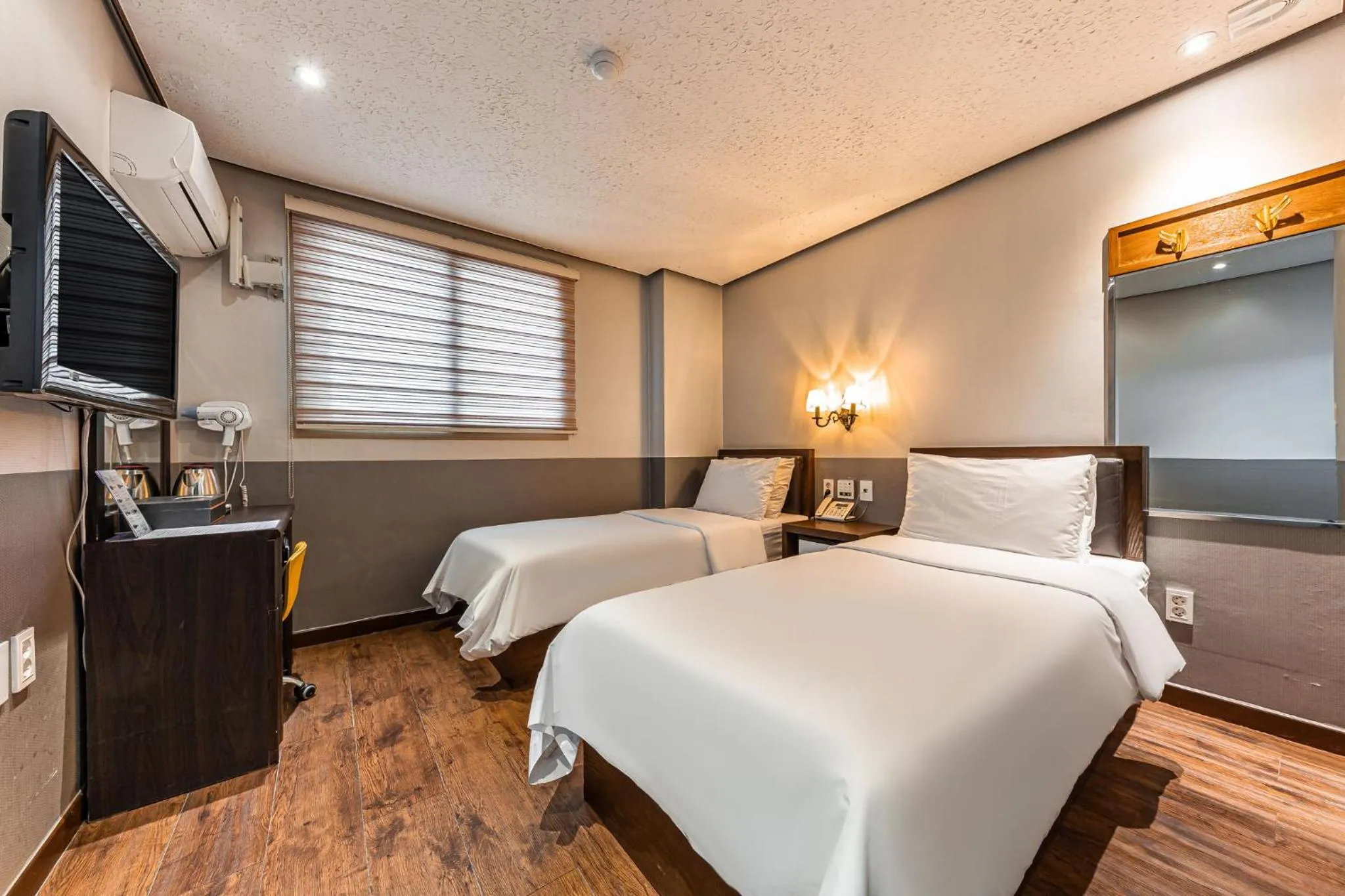 Bed in Friendly DH Naissance Hotel by Mindrum Group